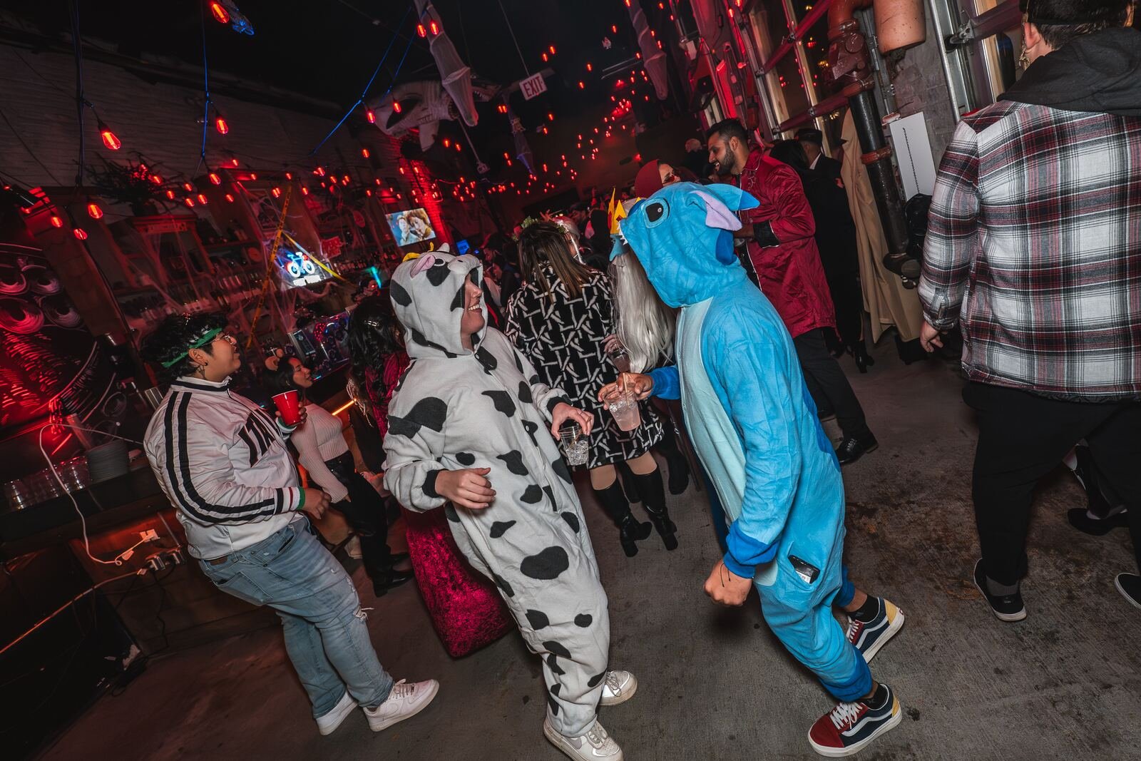 Guests dancing in dalmatian and blue shark onesies on Halloween 2025 at Sea Wolf in Bushwick, Brooklyn