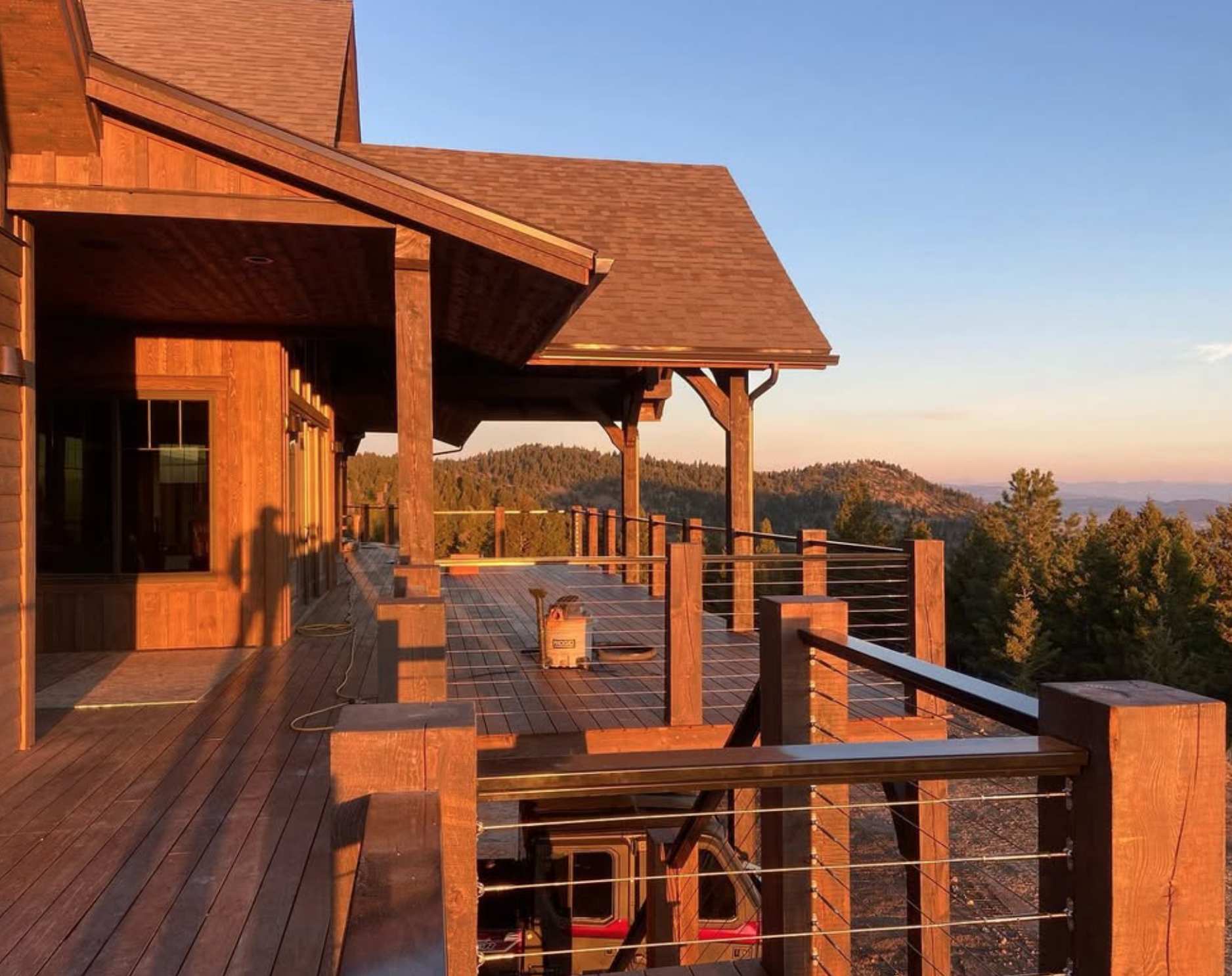 Custom ipe wood deck with railing overlooking Montana landscape