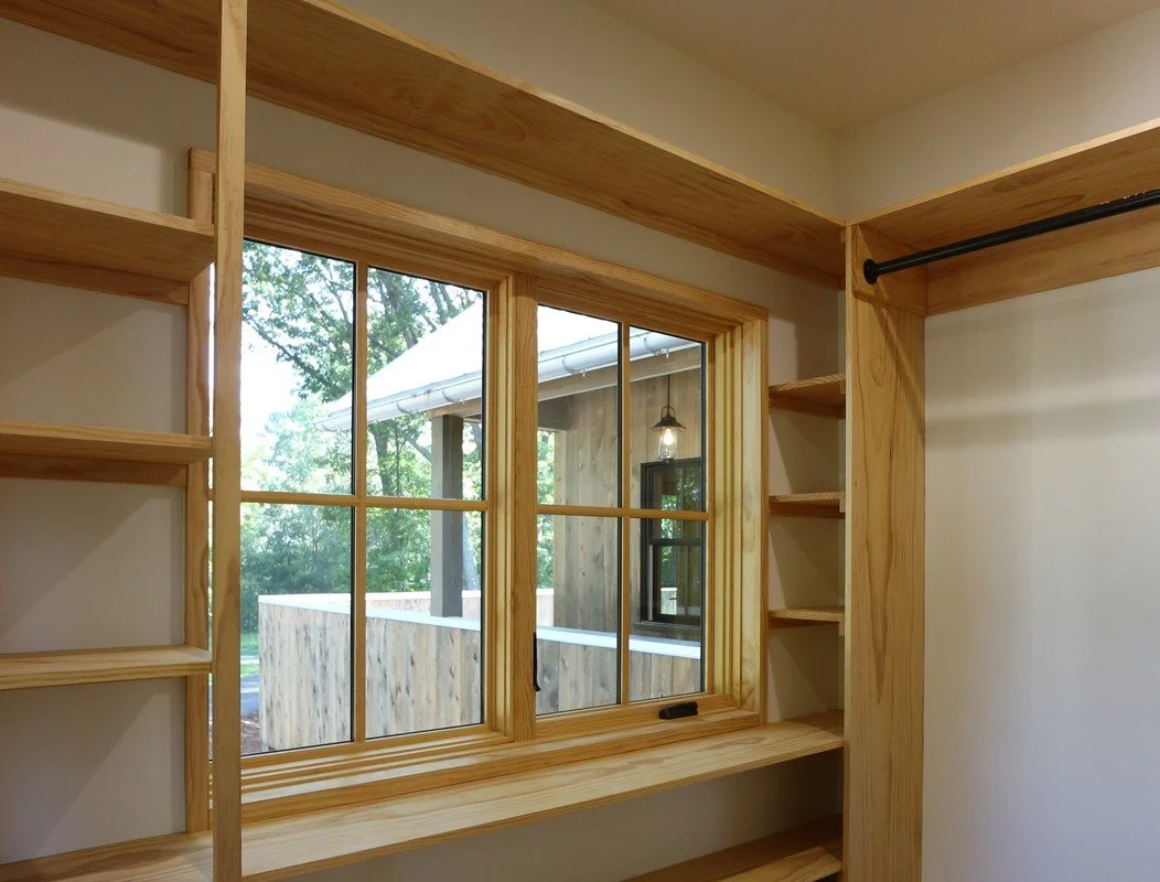 Custom closet shelving with radiata pine wood and integrated storage design