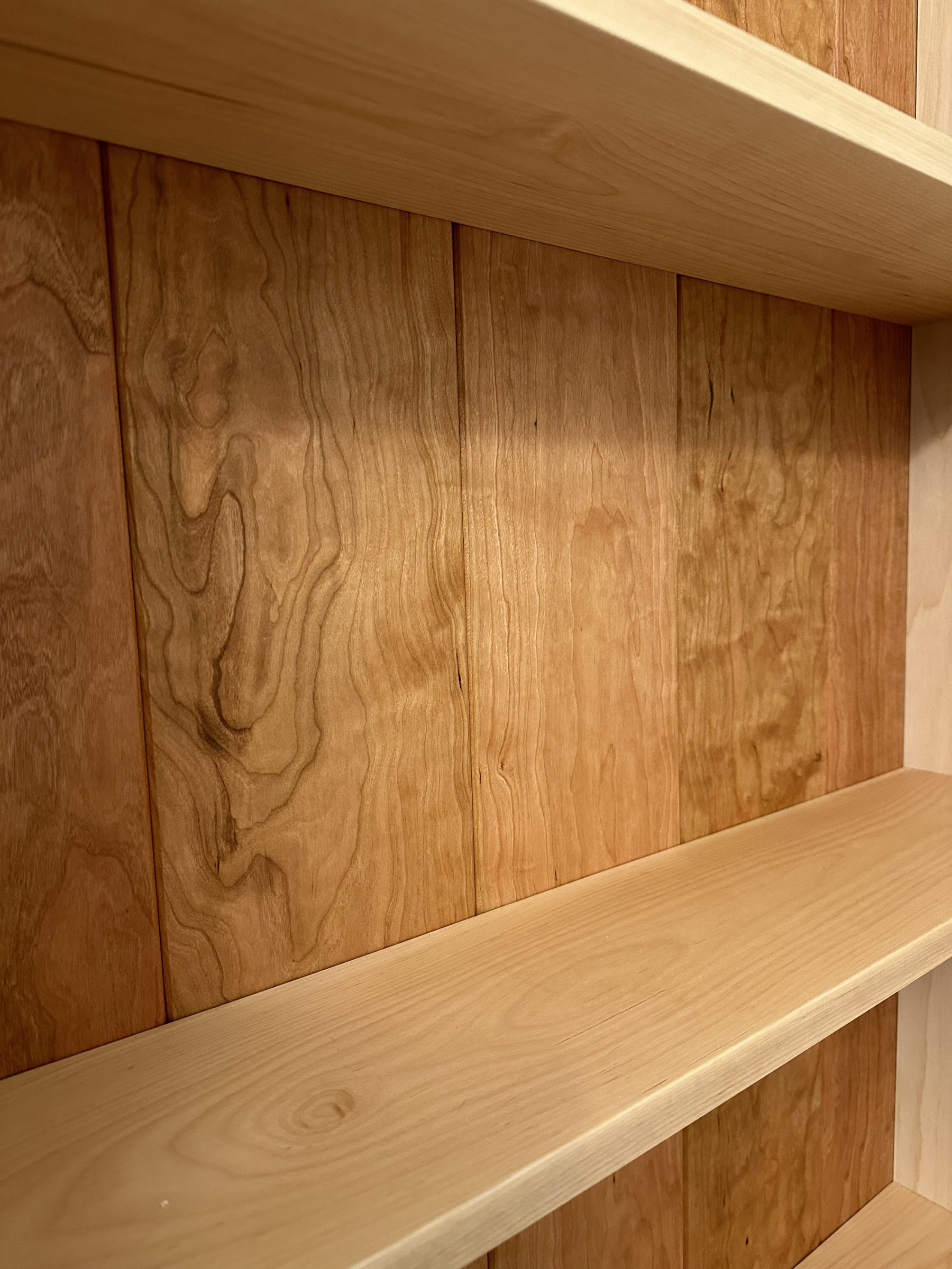 Curly cherry grain detail with natural oil finish