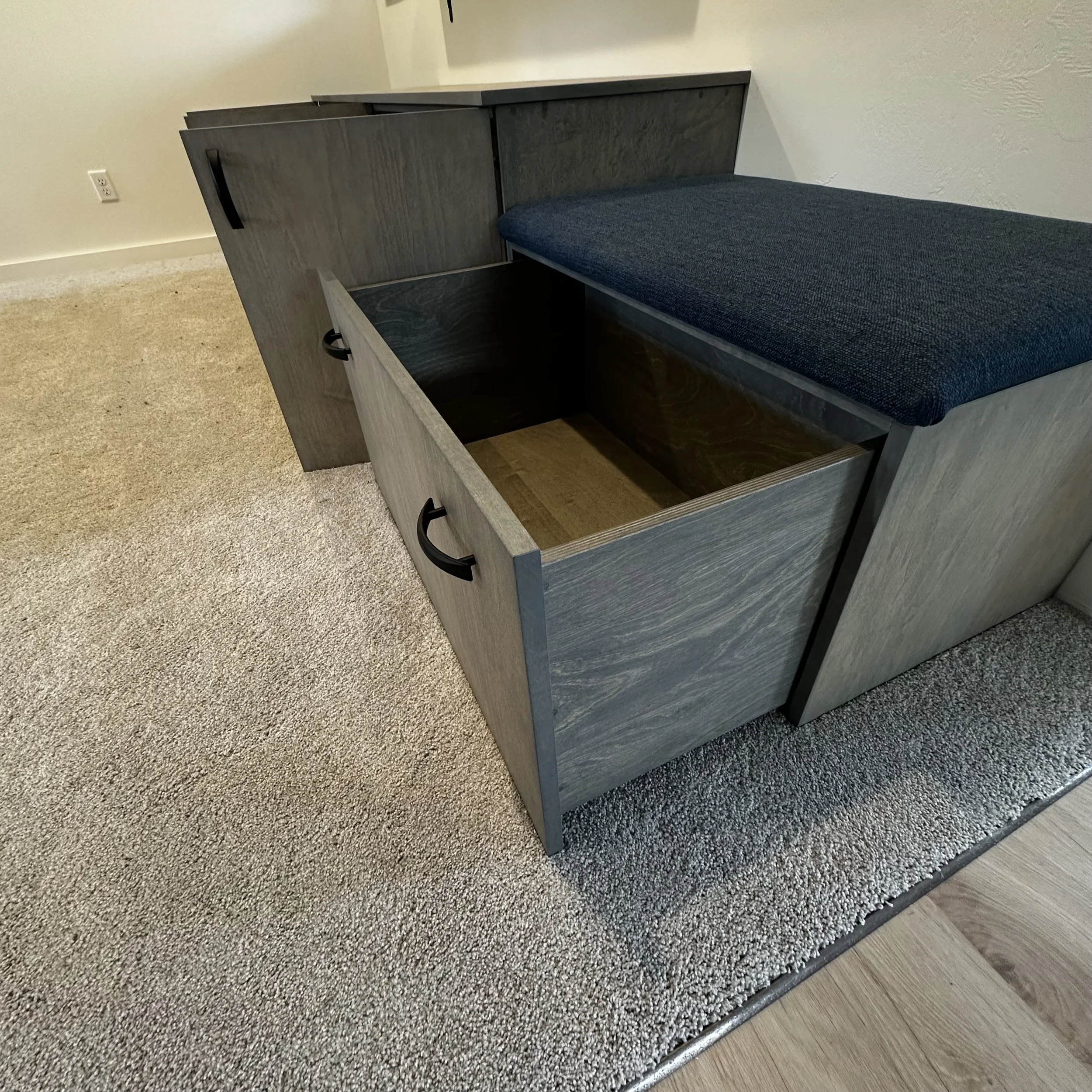 Storage drawer detail with upholstered bench seating