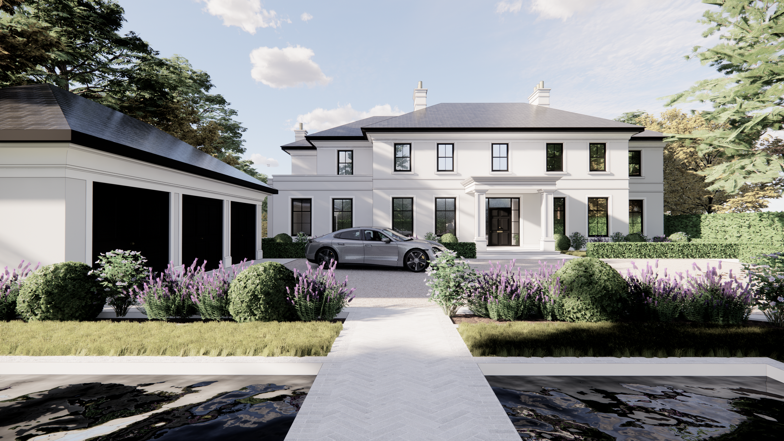 A large white house with black window frames, a black front door, and classical architectural details, set against a blue sky with some clouds. There is a driveway with a parked gray sports car in front of the house, surrounded by purple and green la