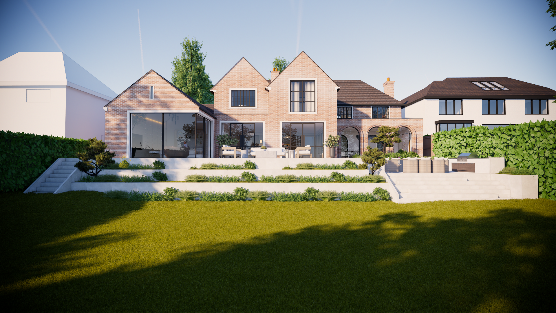 Modern brick house with large glass sliding doors, outdoor terrace with white furniture, well-maintained garden with tiered steps, and lush green lawn, under a clear blue sky.