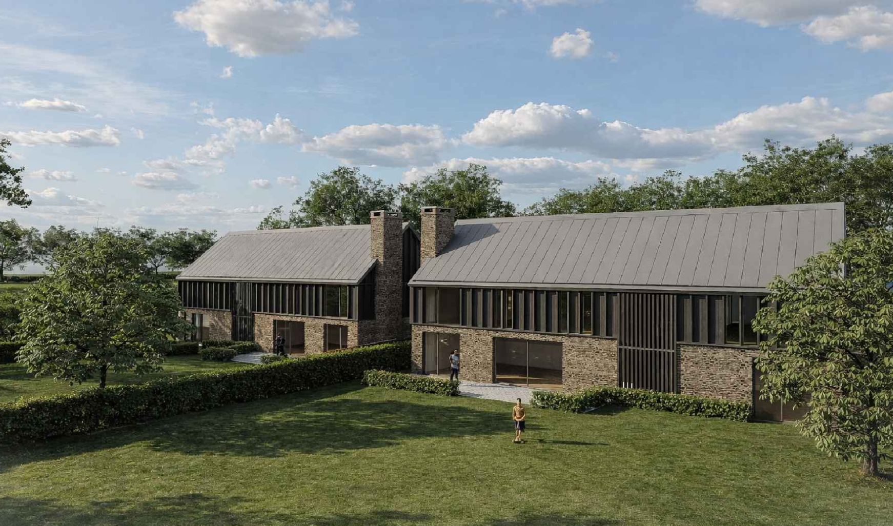 Modern brick and glass building with chimney stacks, surrounded by green lawn and trees under a blue sky with clouds.