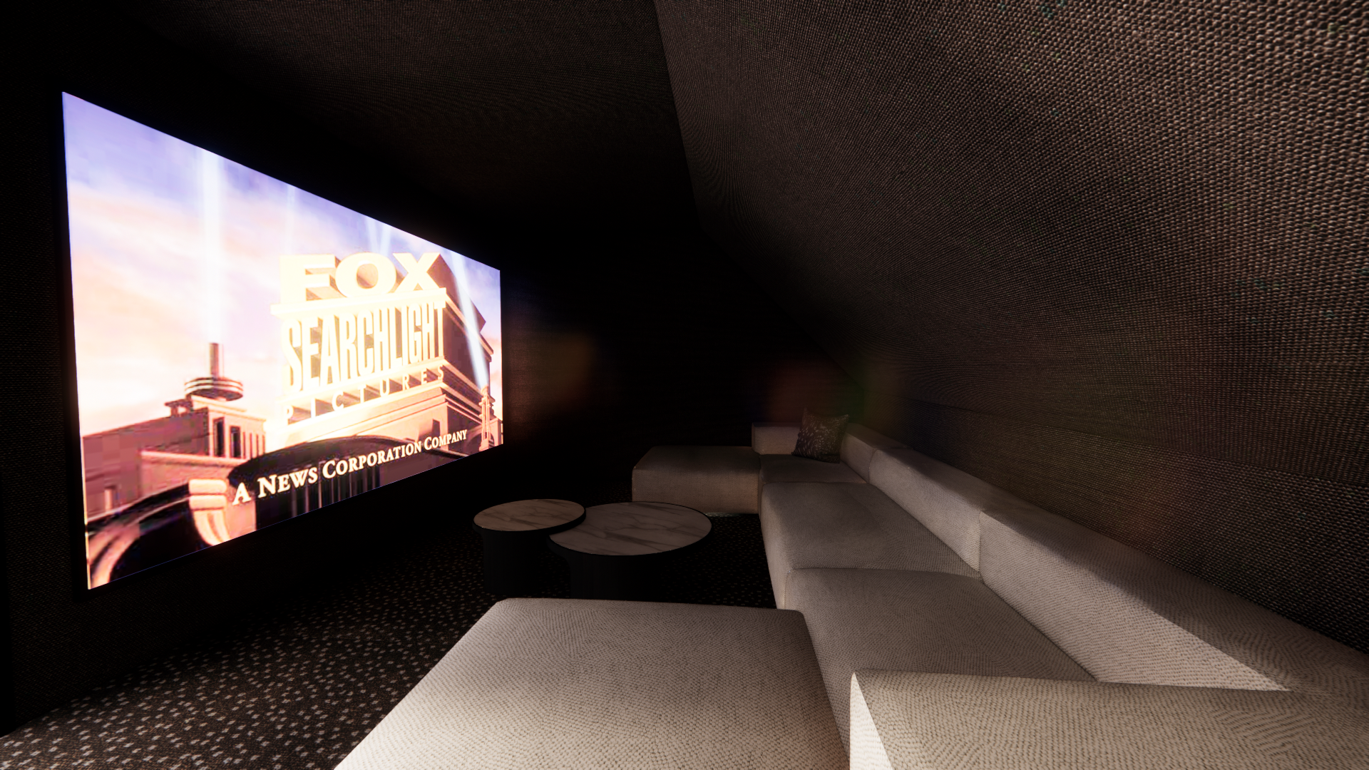 Darkly lit home theater room with a large screen displaying the Fox Searchlight logo, a beige sectional sofa, and small round marble-top tables.