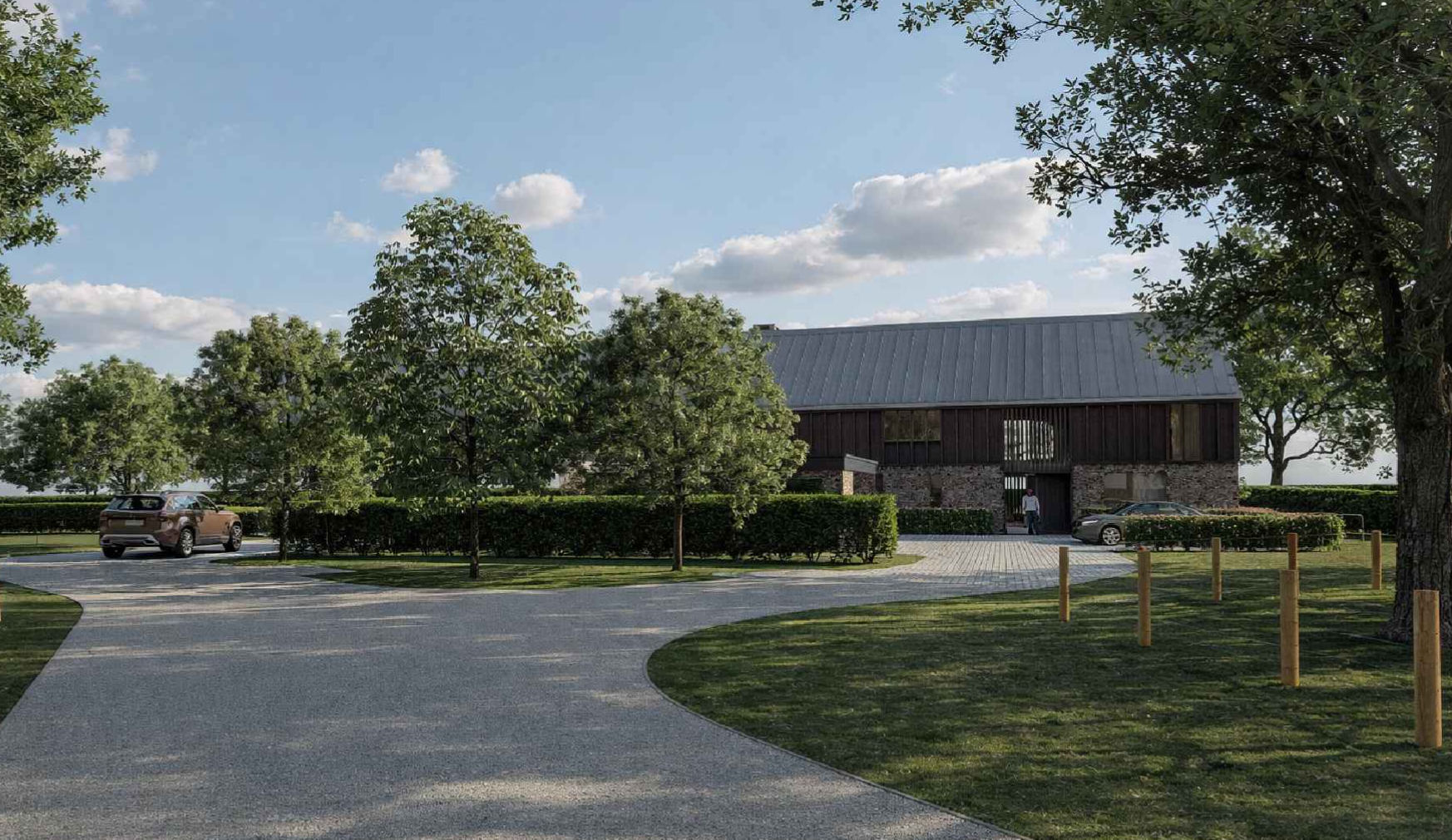 A rural scene with a large barn-like structure, surrounded by green trees and grass, with a paved road and parked cars, under a partly cloudy blue sky.