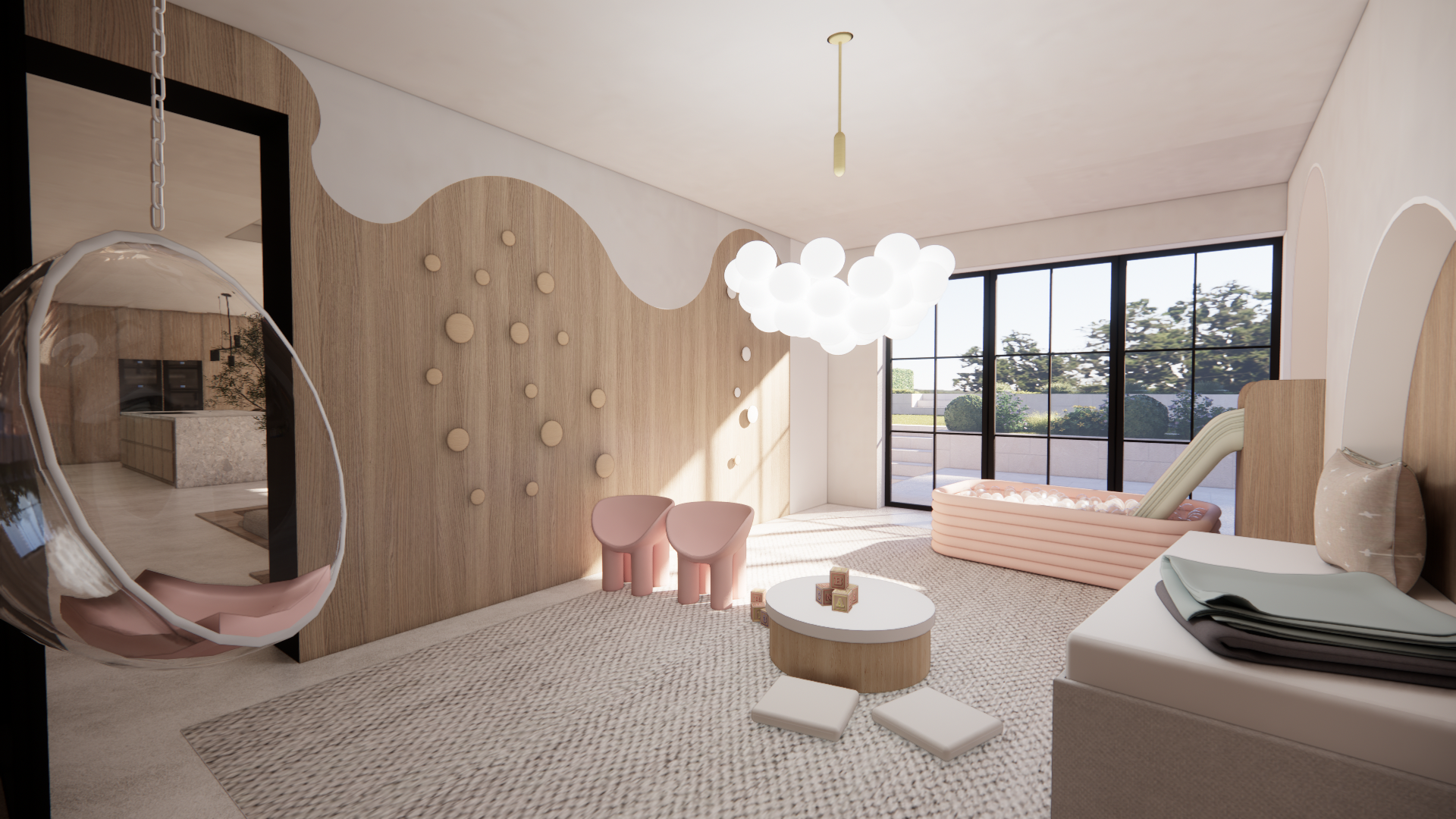 Modern nursery with a wave-shaped wooden accent wall, round pom-pom like wall decor, a cloud-shaped chandelier, a pink inflatable pool with white balls, two pink chairs, and large windows showing trees outside.