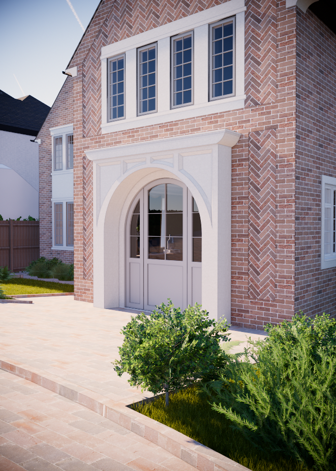 Front view of a brick house entrance with an arched windowed door, multiple windows above, a paved walkway, and landscaped bushes in the foreground.