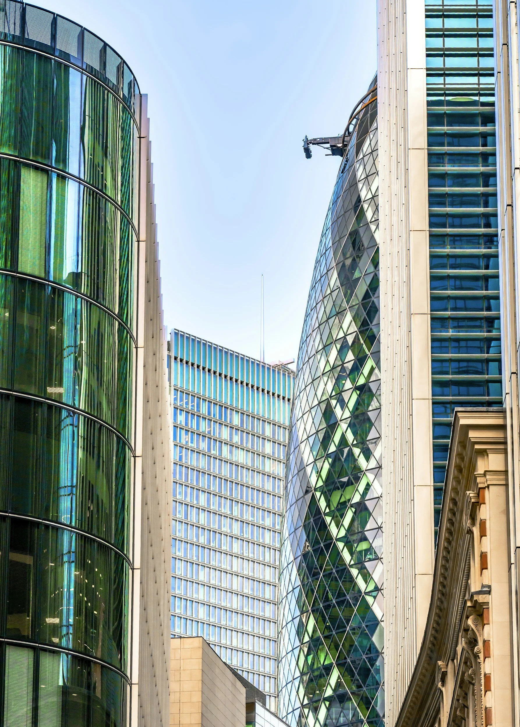 Tall modern glass skyscrapers with reflective windows in an urban cityscape