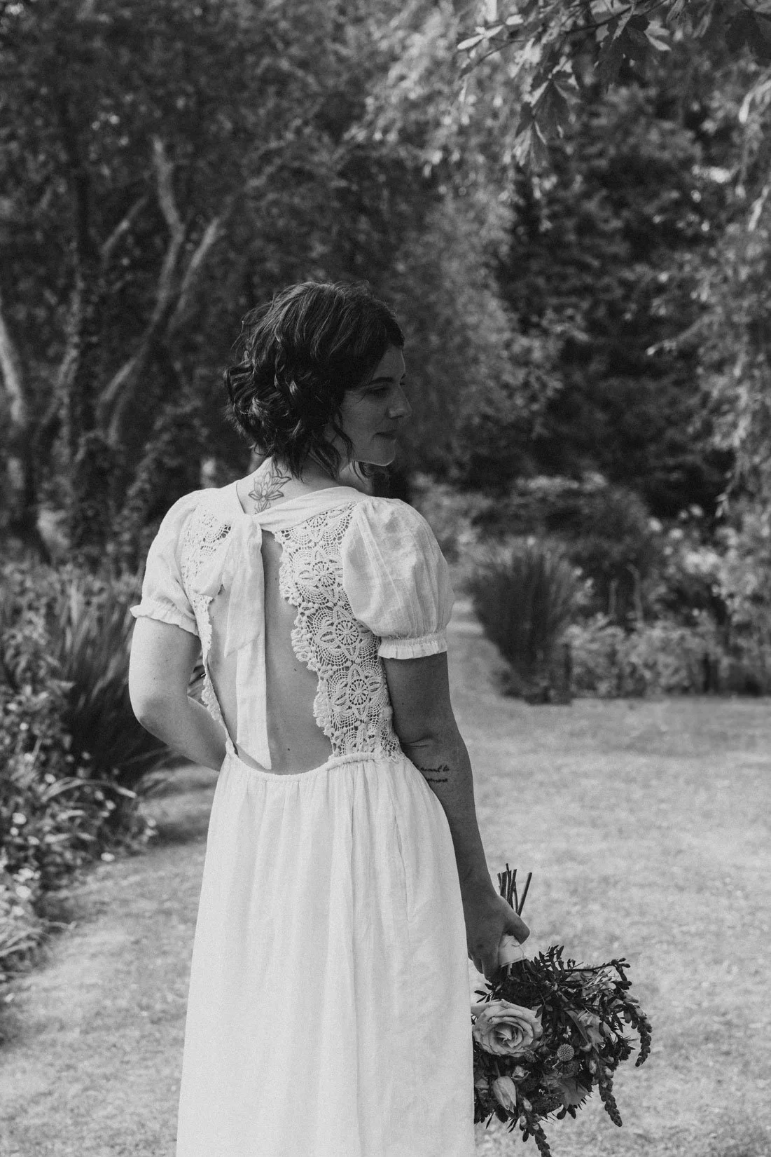Relaxed editorial wedding portrait overlooking the sea at Watermouth Cove in Devon