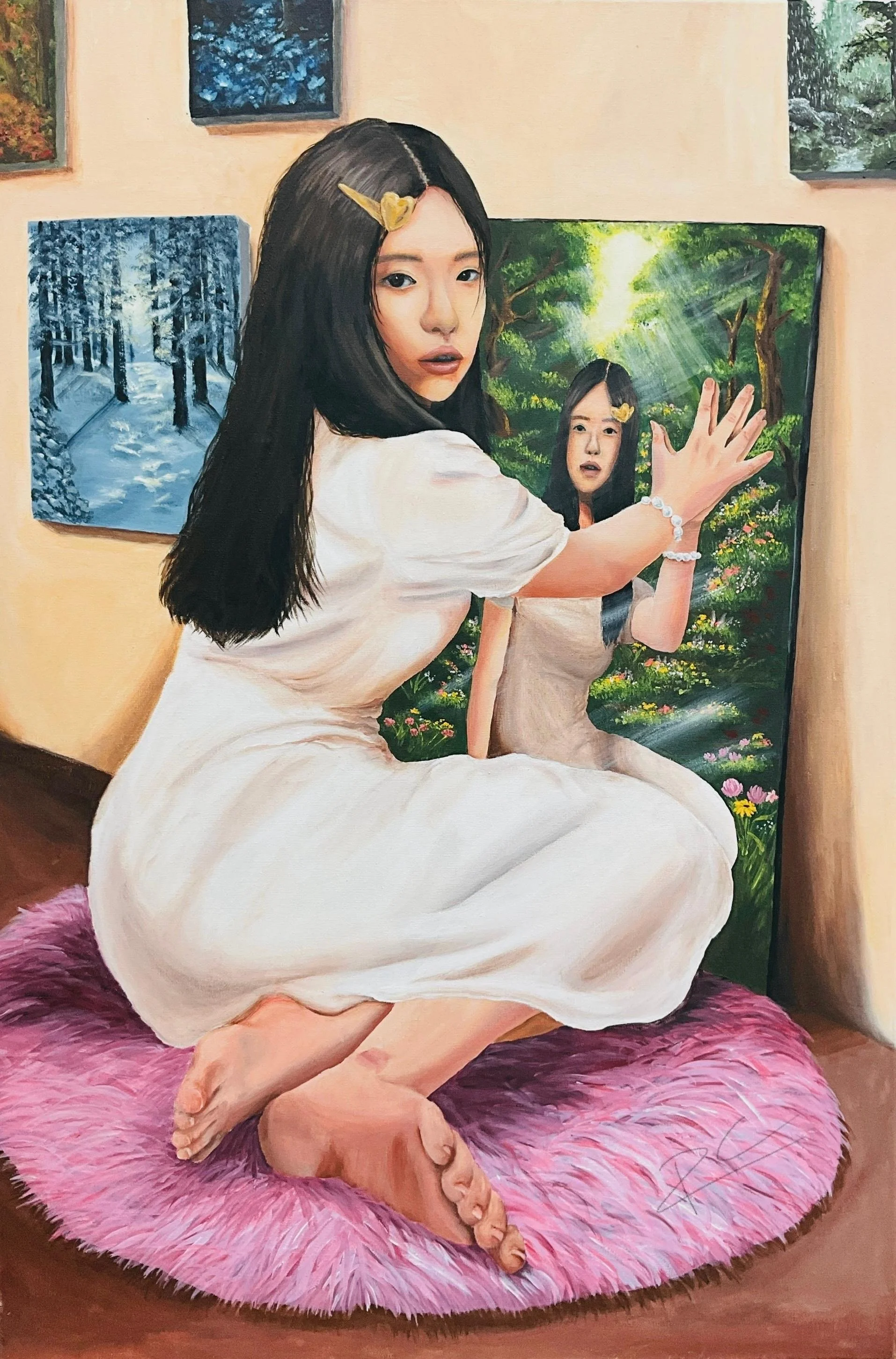 A woman with long dark hair, wearing a white dress, kneels on a pink fluffy rug in front of a mirror. She poses with her hand against the mirror, which reflects her face. The background features several landscape paintings on the wall, including a snowy forest scene and a lush green forest with sunlight.