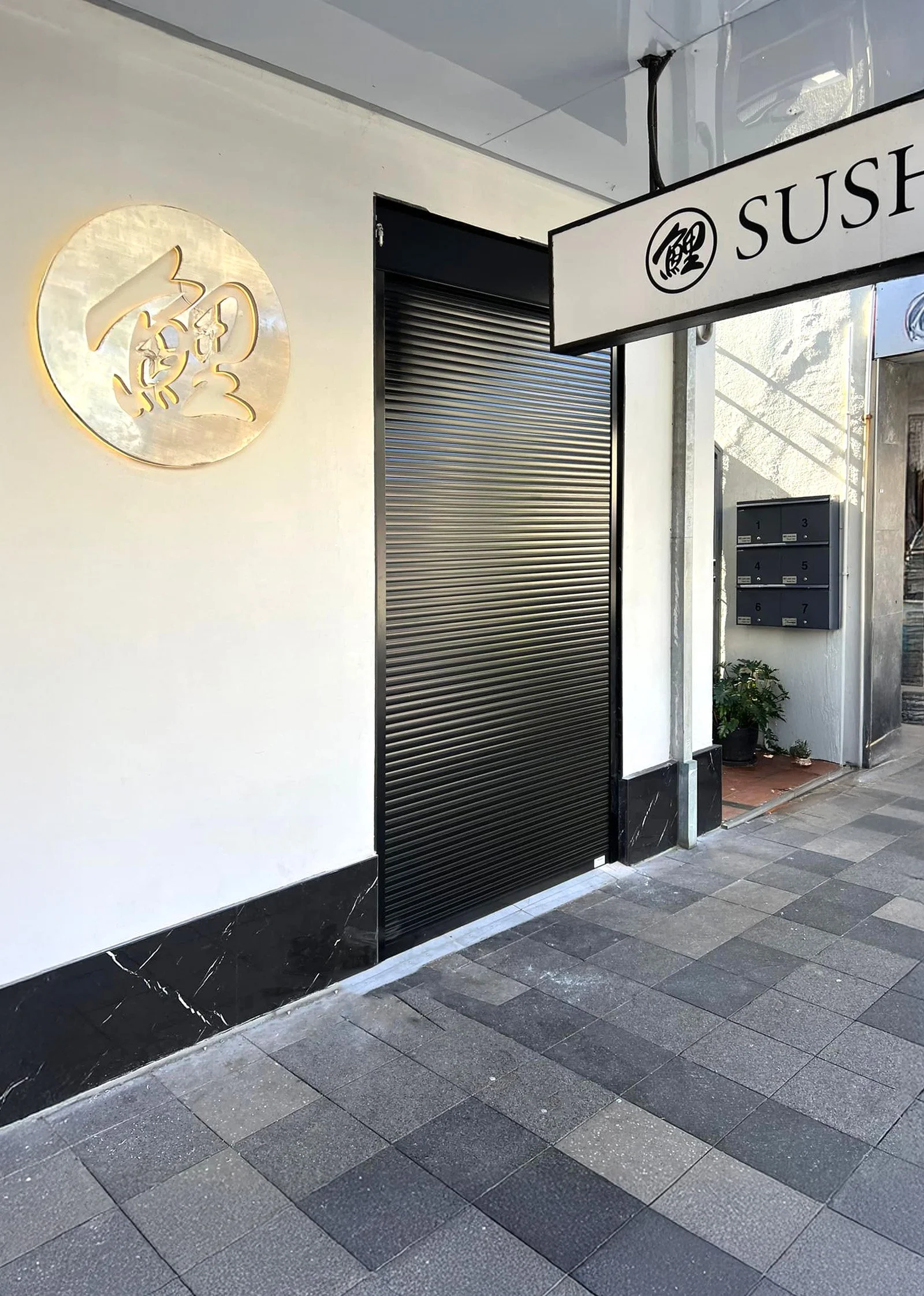 Exterior of a Japanese sushi restaurant located in Sydney, using Roller Shutters from JJ Roller Shutters, located in NSW.