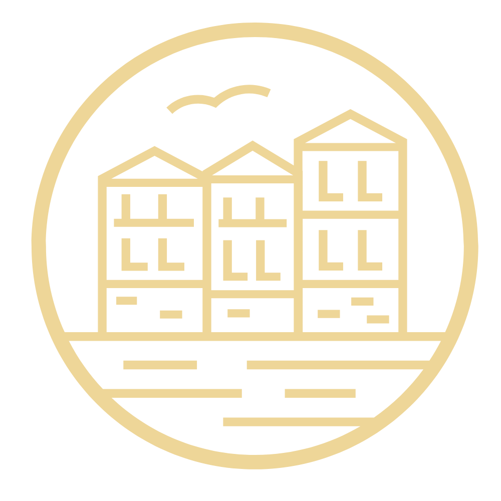 Outline of three apartment buildings with mountains, sun or moon, and water in the background, enclosed in a circular border.