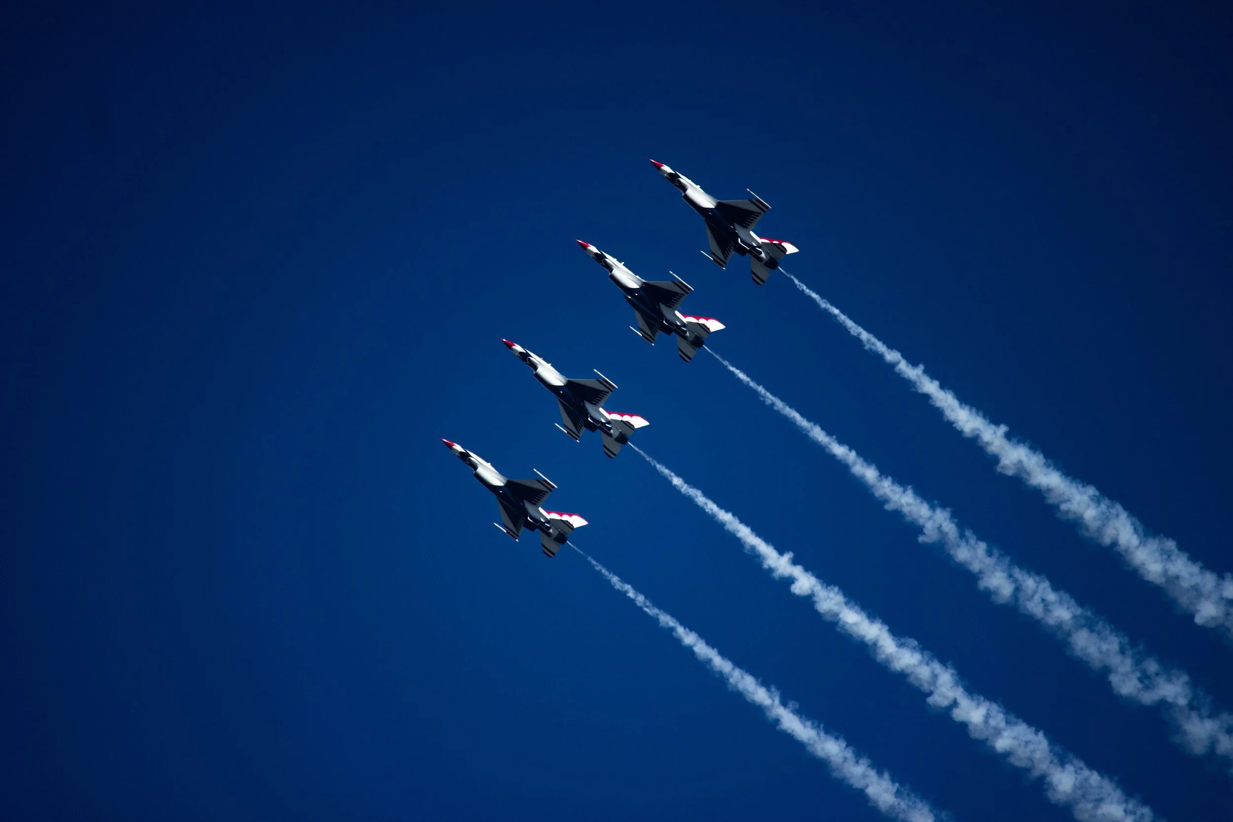 Four jet planes in the sky