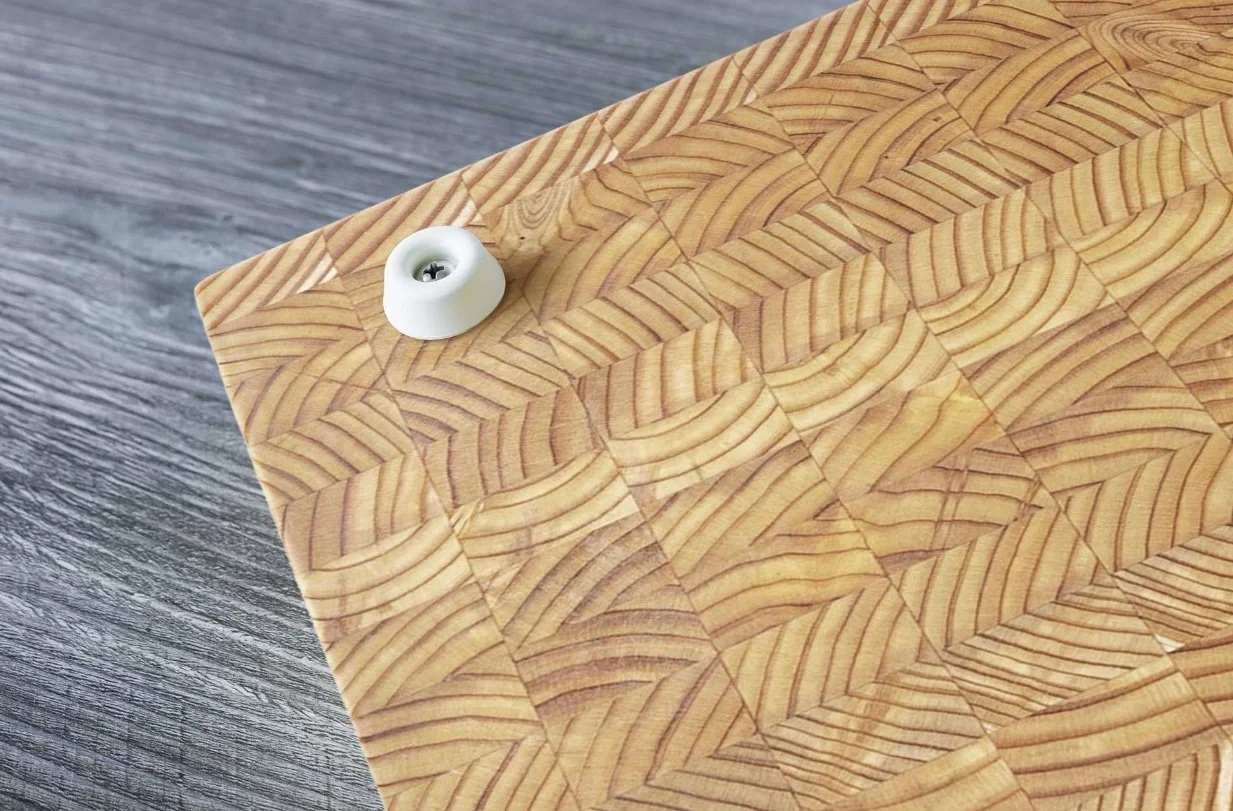 Macro detail of self-healing Canadian Larch wood grain on a professional Larchsmith culinary surface.