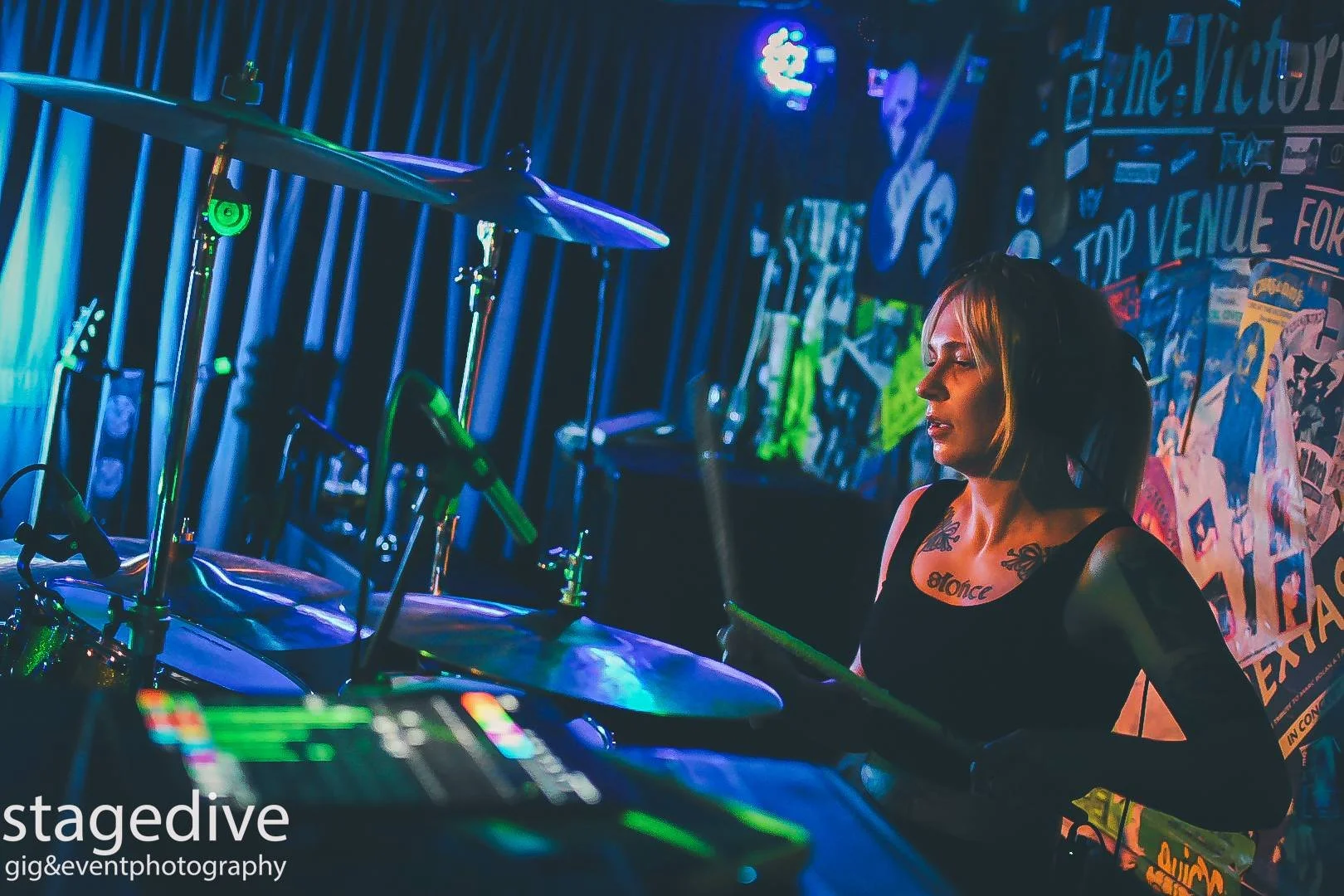 Aggy Nowicka, female drummer with the Welsh rock band 'James Kennedy and The Underdogs' on stage at a festival playing drums