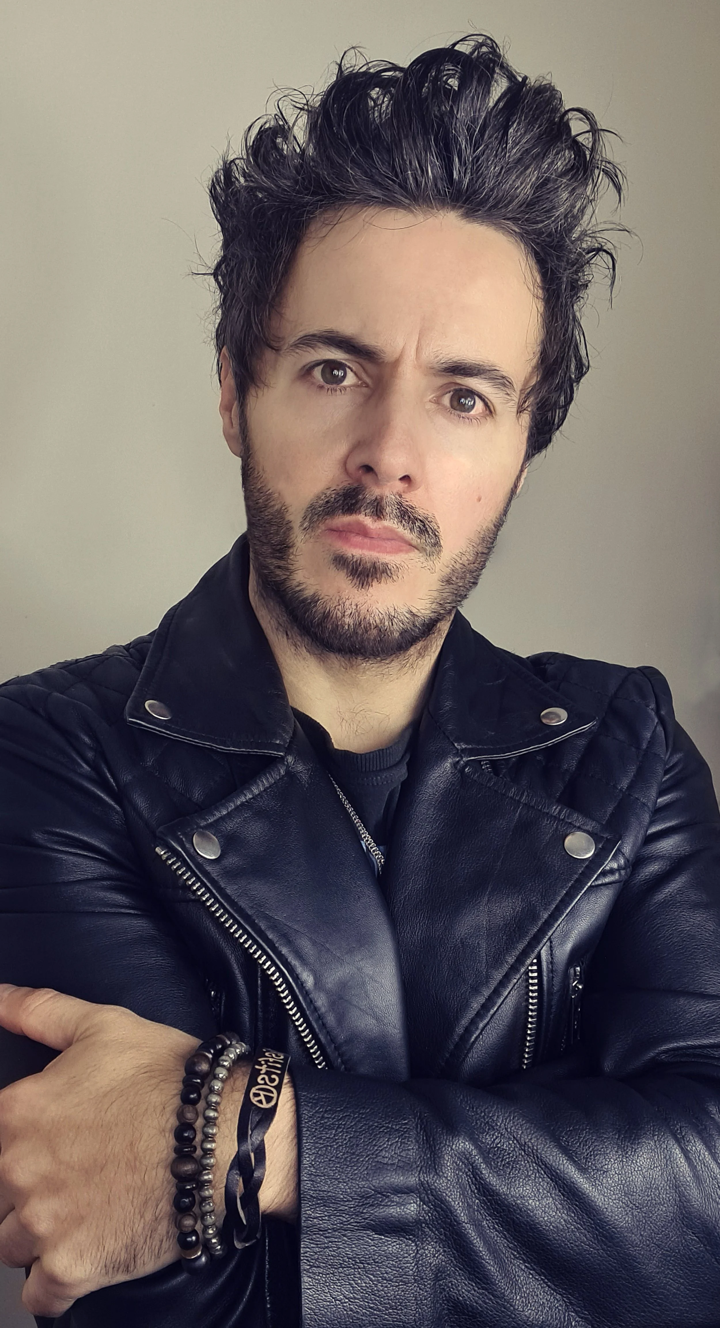James Kennedy, the singer, author and podcaster from Wales and frontman of the band 'James Kennedy and The Underdogs' posing in a leather jacket and spike hair
