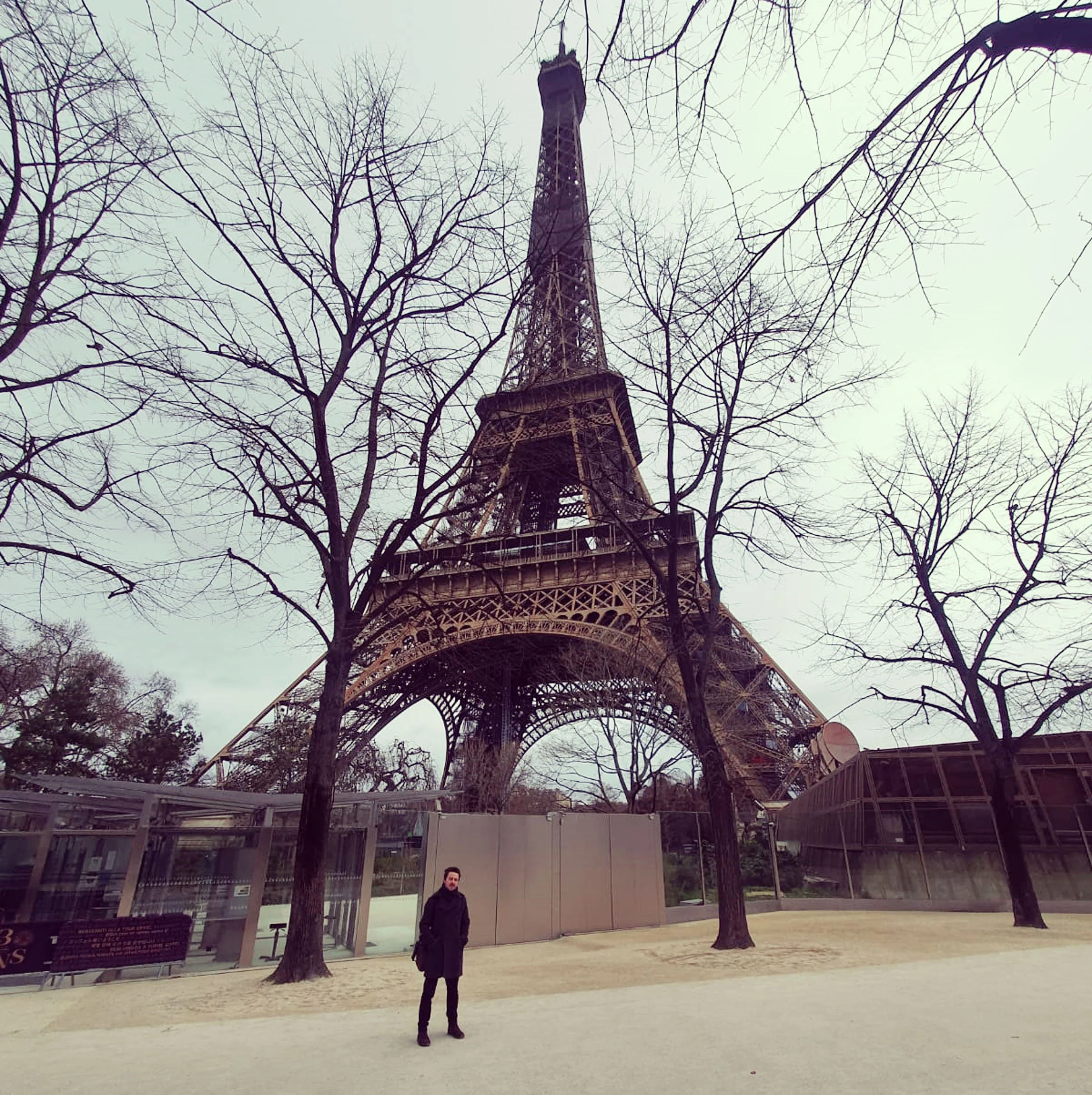 The Eiffel Tour in Paris with only one person stood in front of it: singer songwriter, James Kennedy 