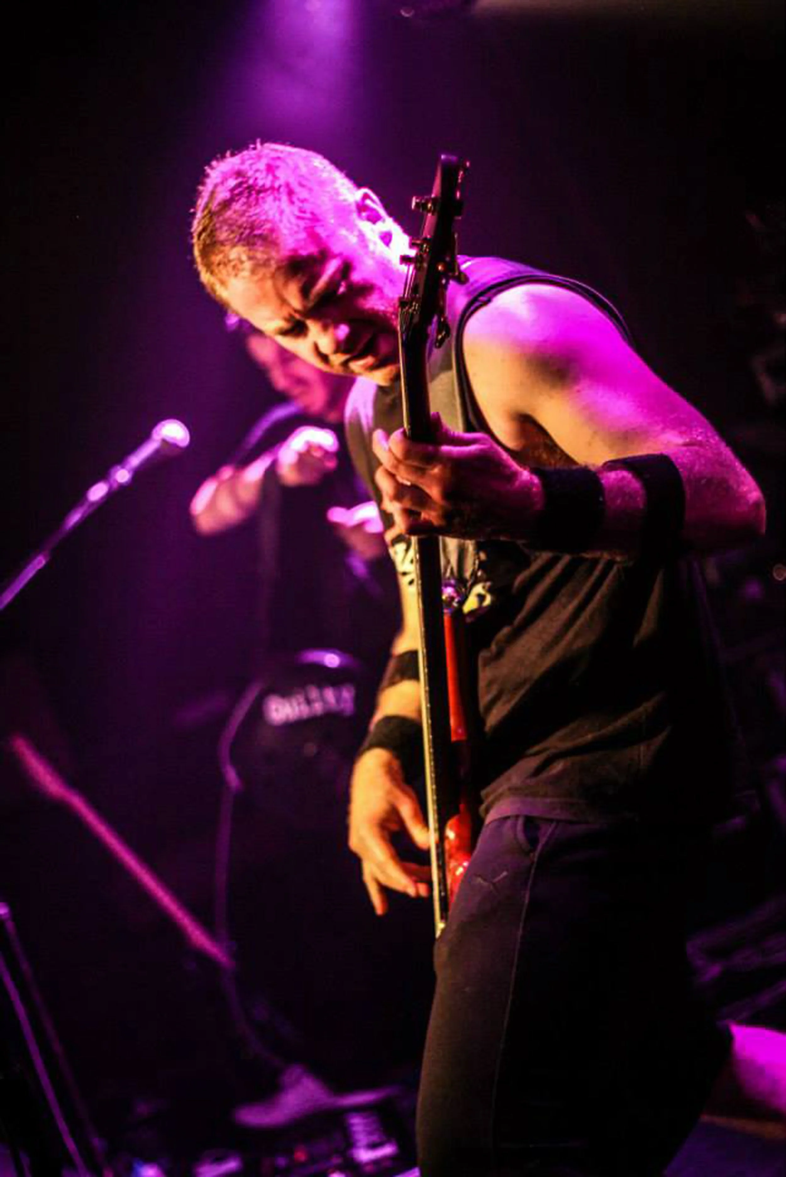 Matt Warr, the bassist with the rock band 'Kyshera' playing bass at a live concert with Kyshera in London 