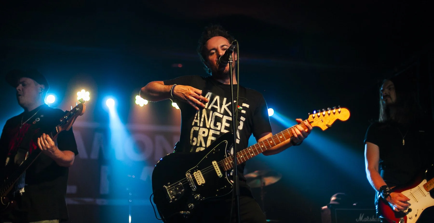 'James Kennedy and The Underdogs', the hard rock band from Wales UK on stage together playing a concert in Sheffield 2024