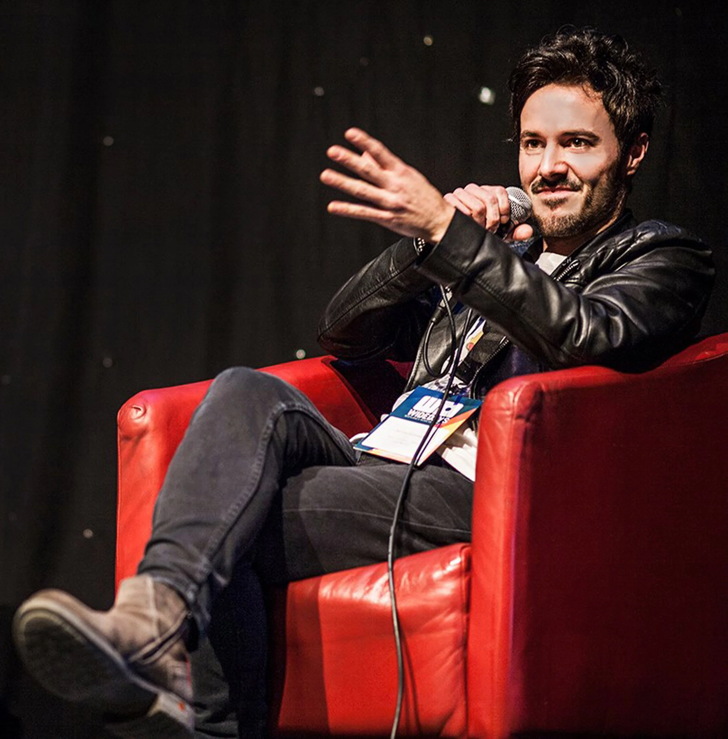 James Kennedy, the singer, author and podcaster giving a speech at a music convention in Edinburgh