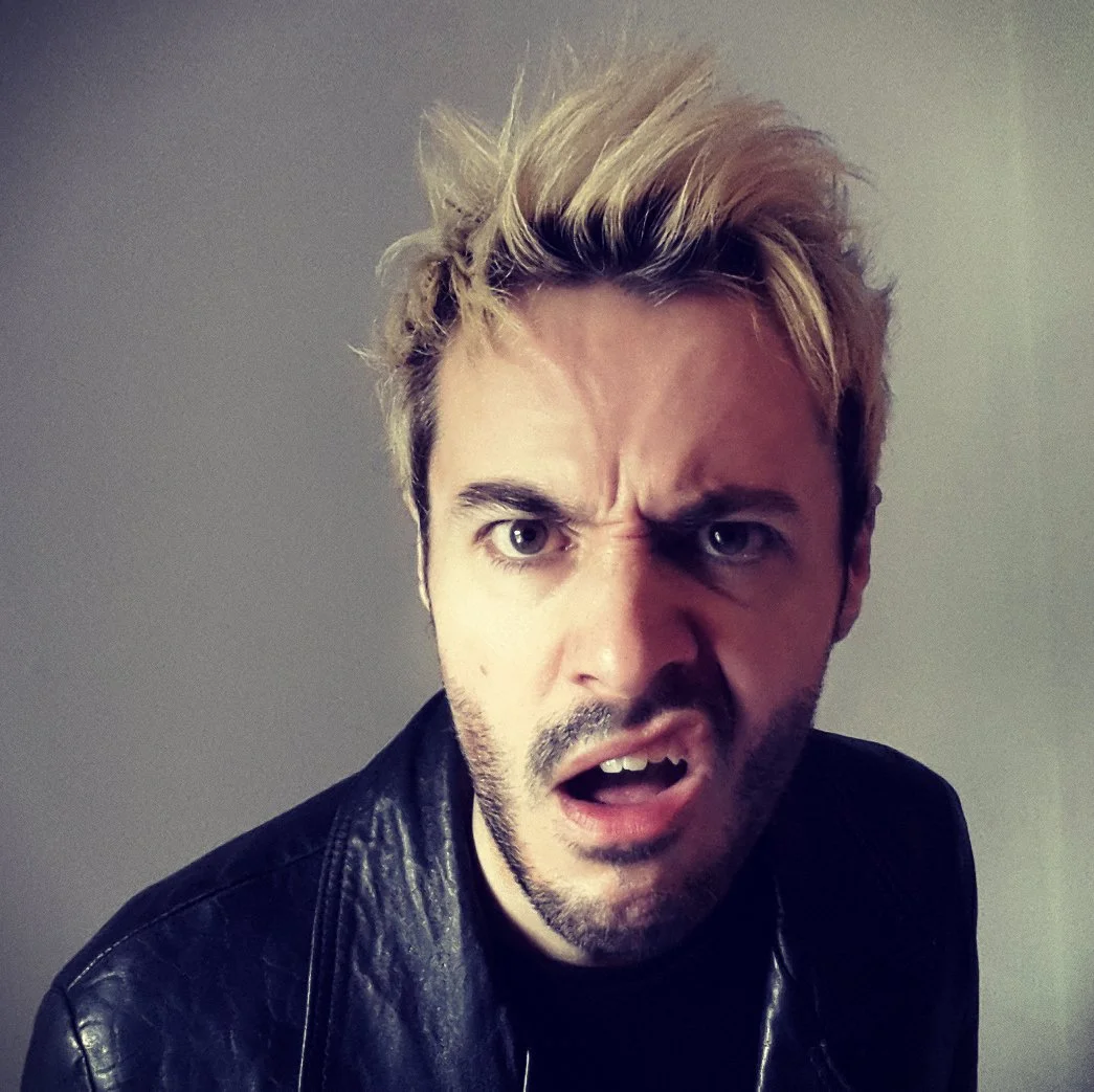James Kennedy, the singer and frontman of the rock bands 'Kyshera' and 'James Kennedy and The Underdogs' posing with blond hair