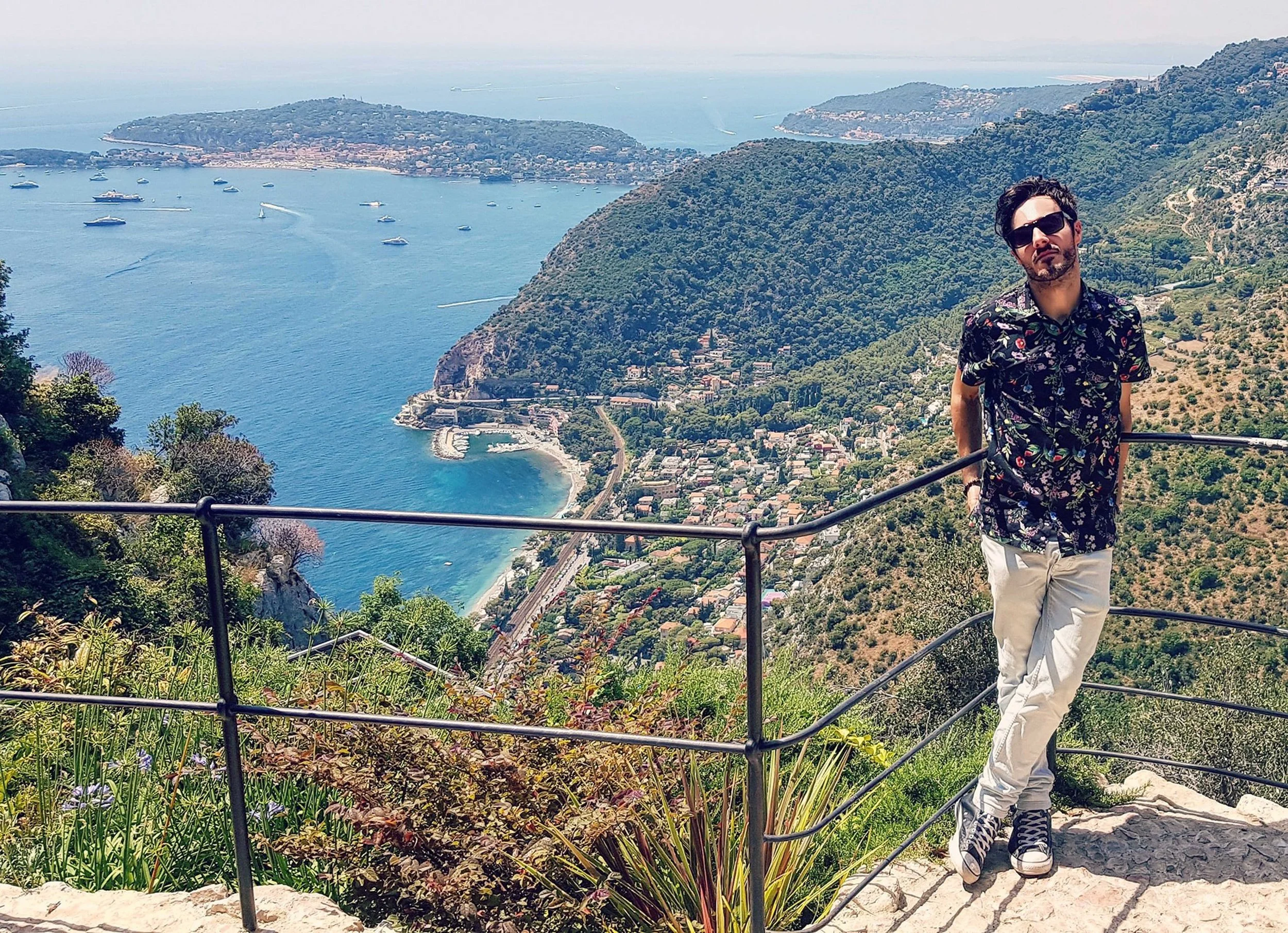 James Kennedy, the author and podcaster posing in the South of France overlooking the sea and landscape 