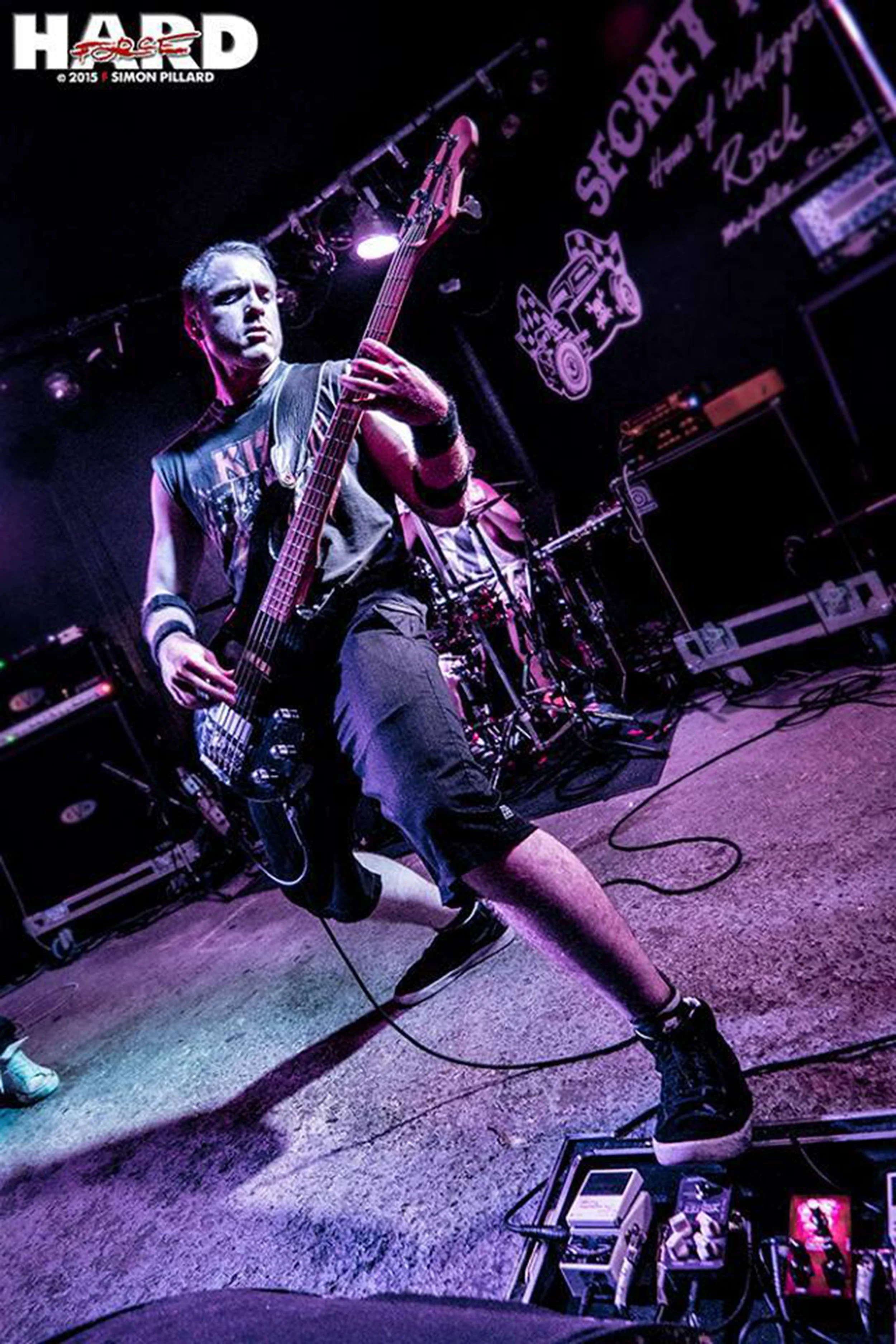 Kyshera bassist, Matt Warr playing bass at a concert in the Secret Place music venue in Montpellier France with the rock band 'Kyshera'