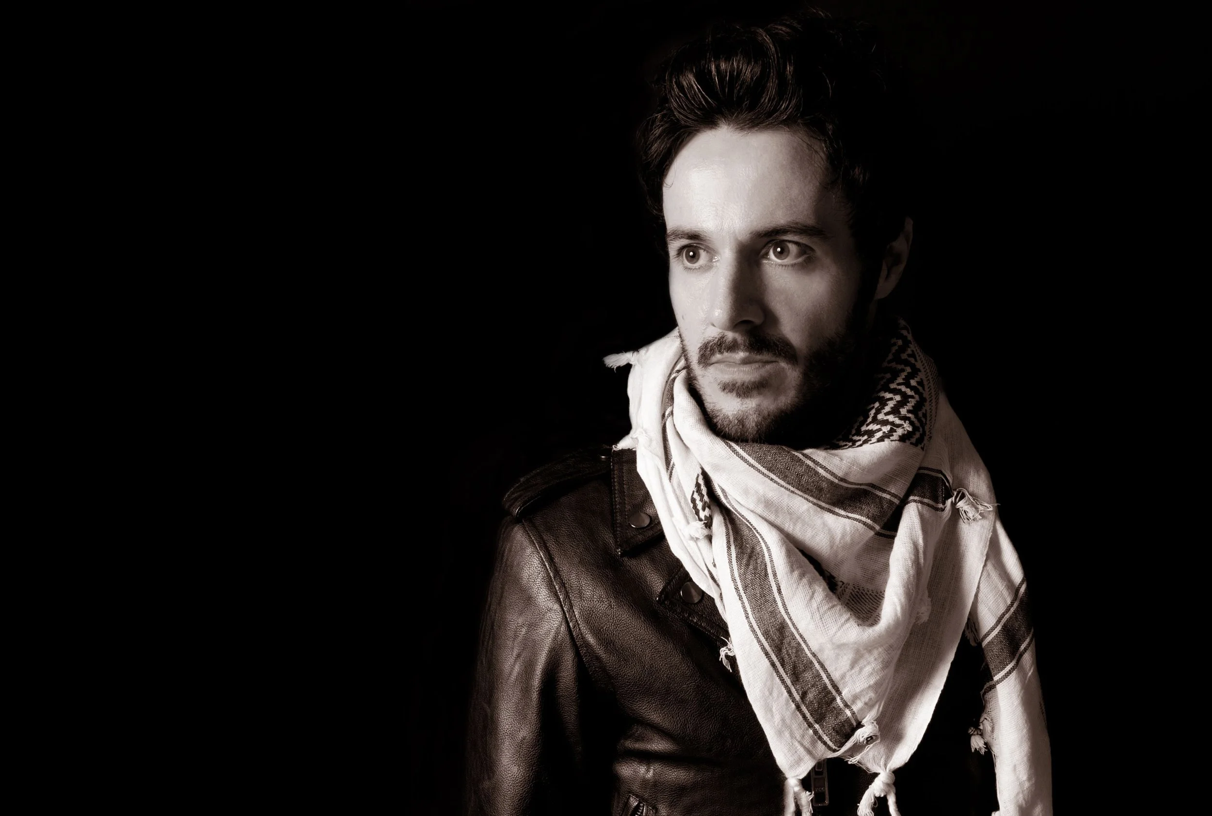 James Kennedy, singer with the Welsh rock band 'James Kennedy and The Underdogs' wearing a Palestinian scarf