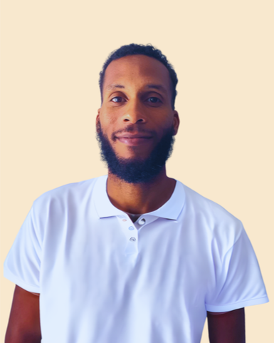 Portrait of a man wearing a white polo shirt, smiling, with a beige background.