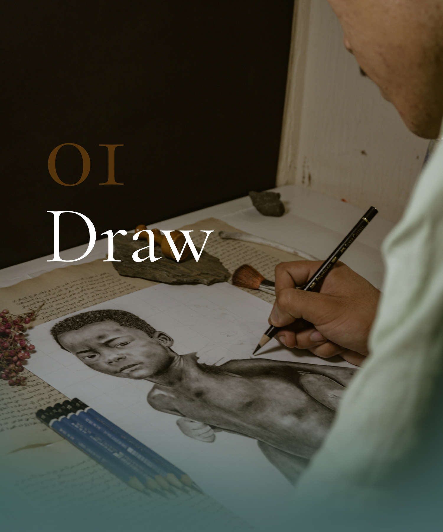 A person drawing a portrait of a young boy with dark hair, on paper, surrounded by writing, rocks, and pens.