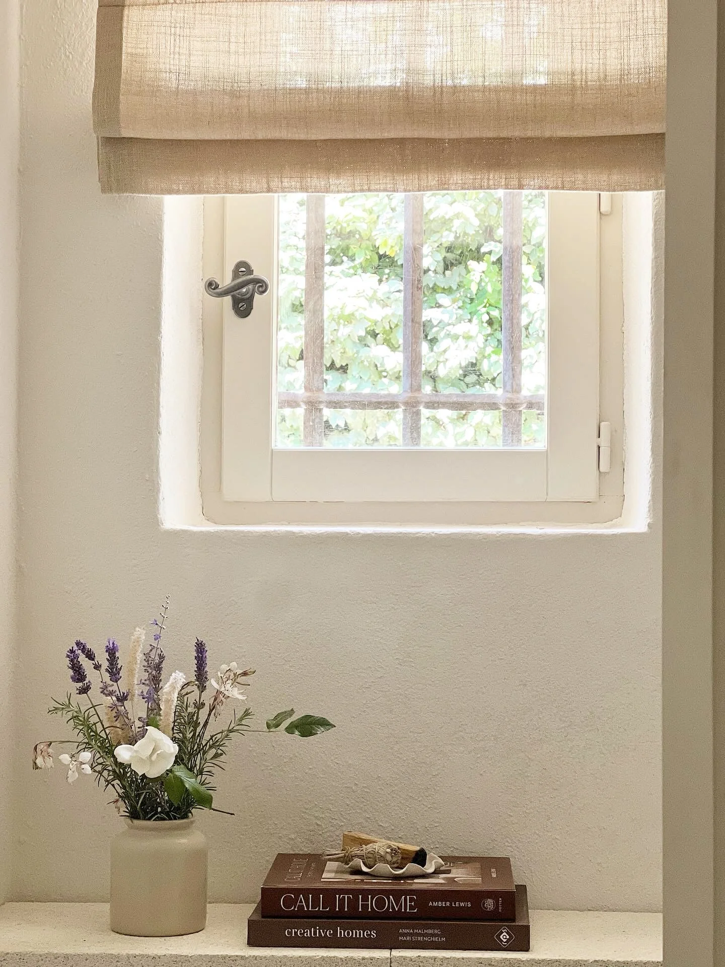 Interior books, wild flowers, sheer linen blind, provence