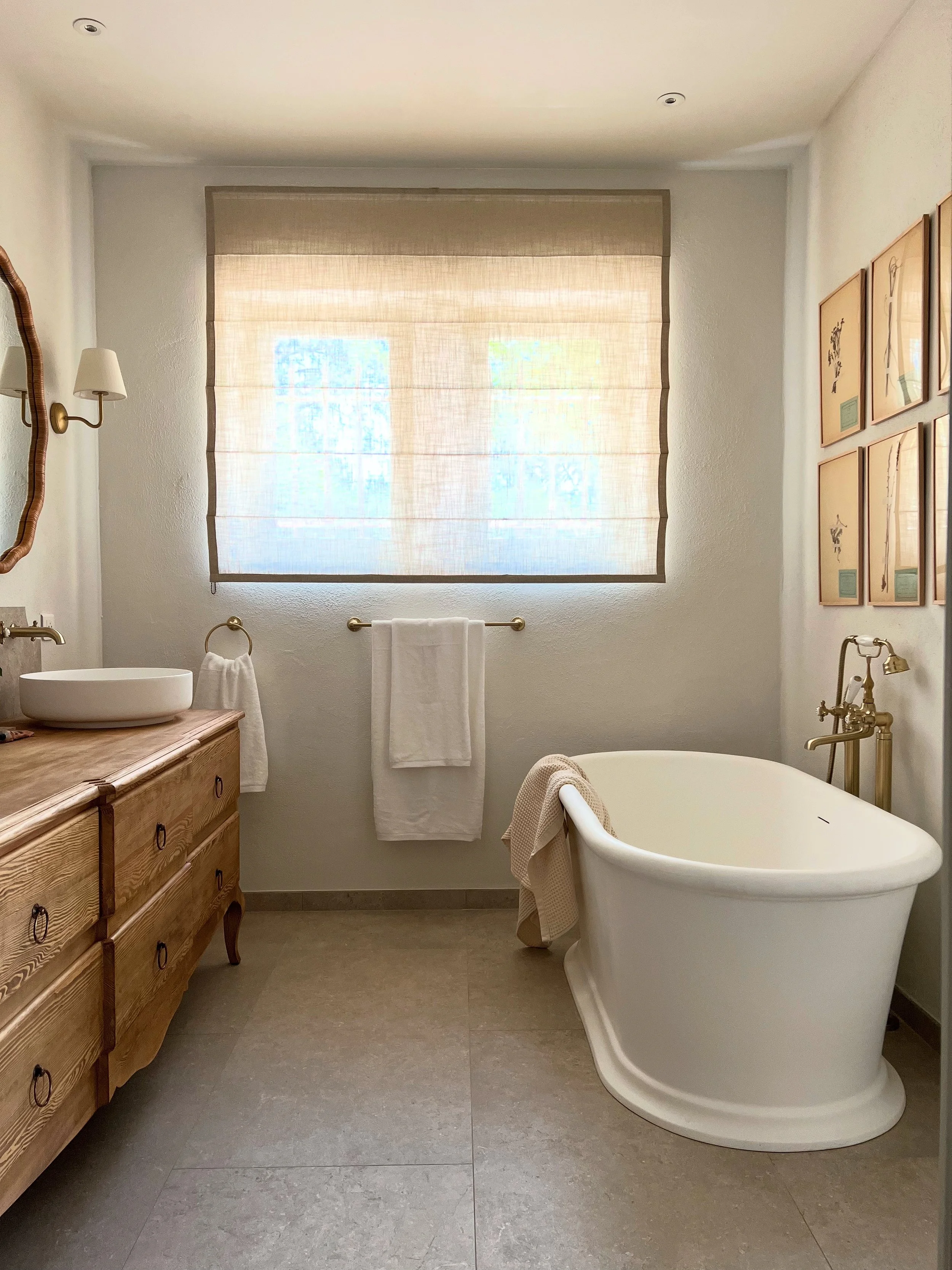 wooden vanity, timber vanity, bath tub, luxury bath, sheer linen blind, light space, corston lights, stone floor, dried flowers, art, herbier, provence, wellness
