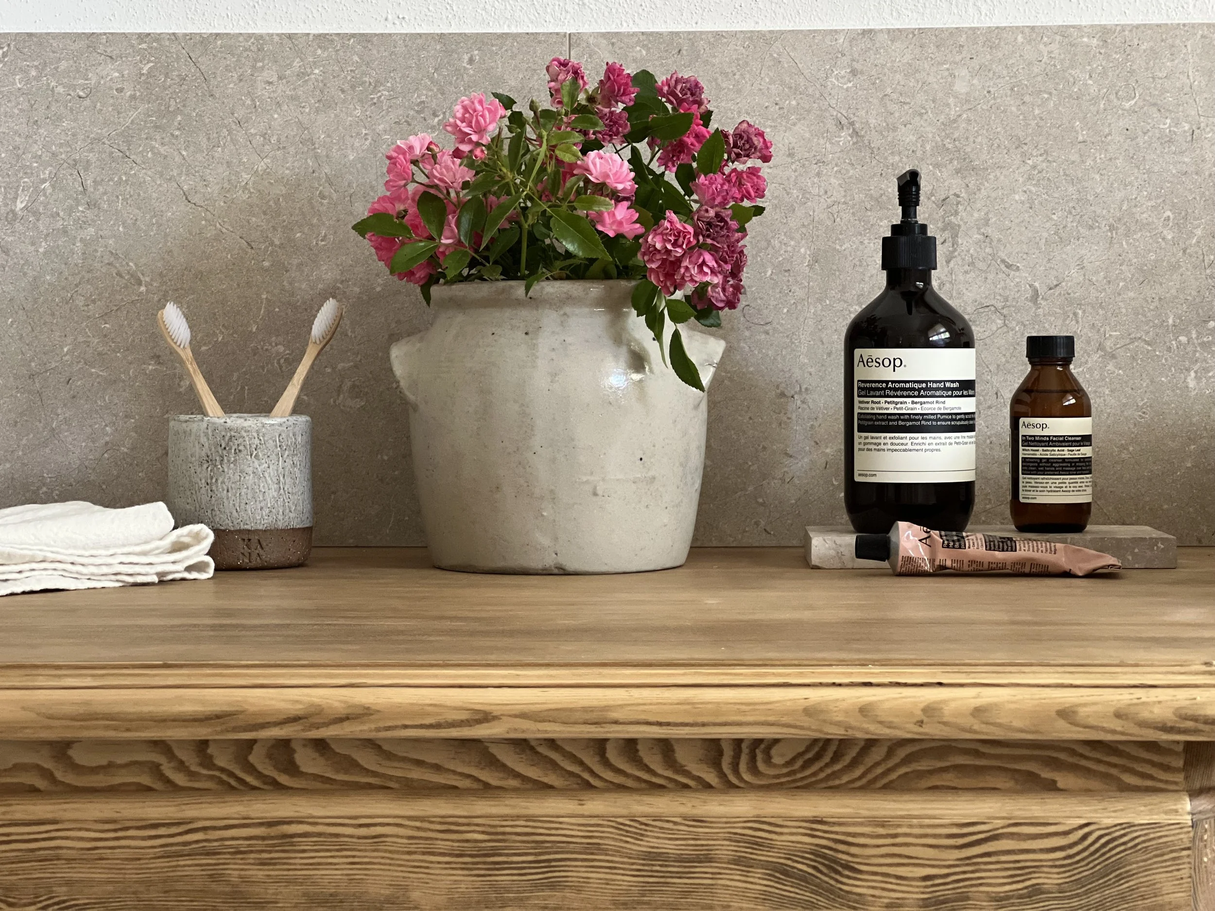 bathroom styling, Aesop, roses, pottery