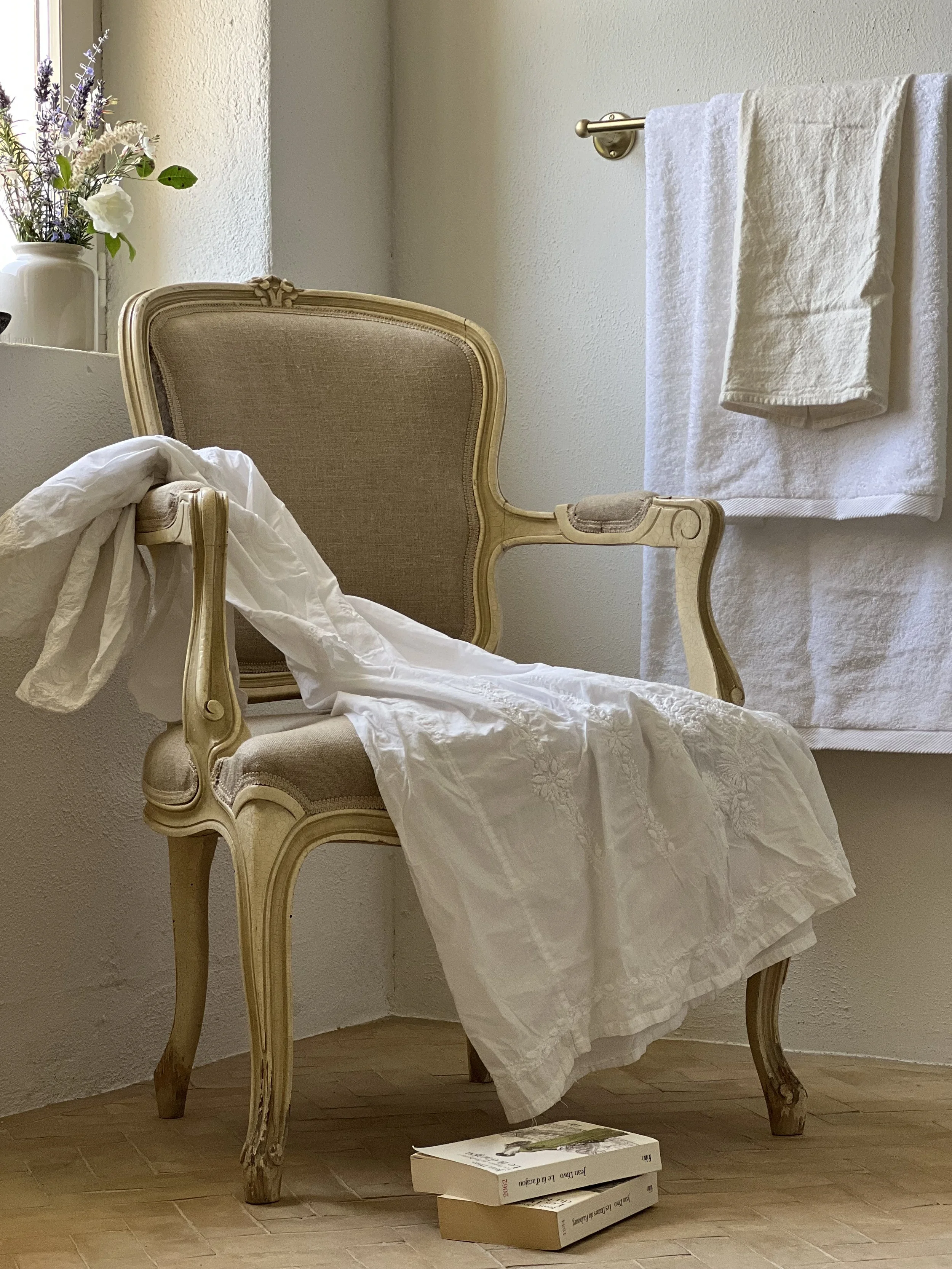 antique chair, antique dress, books, flowers