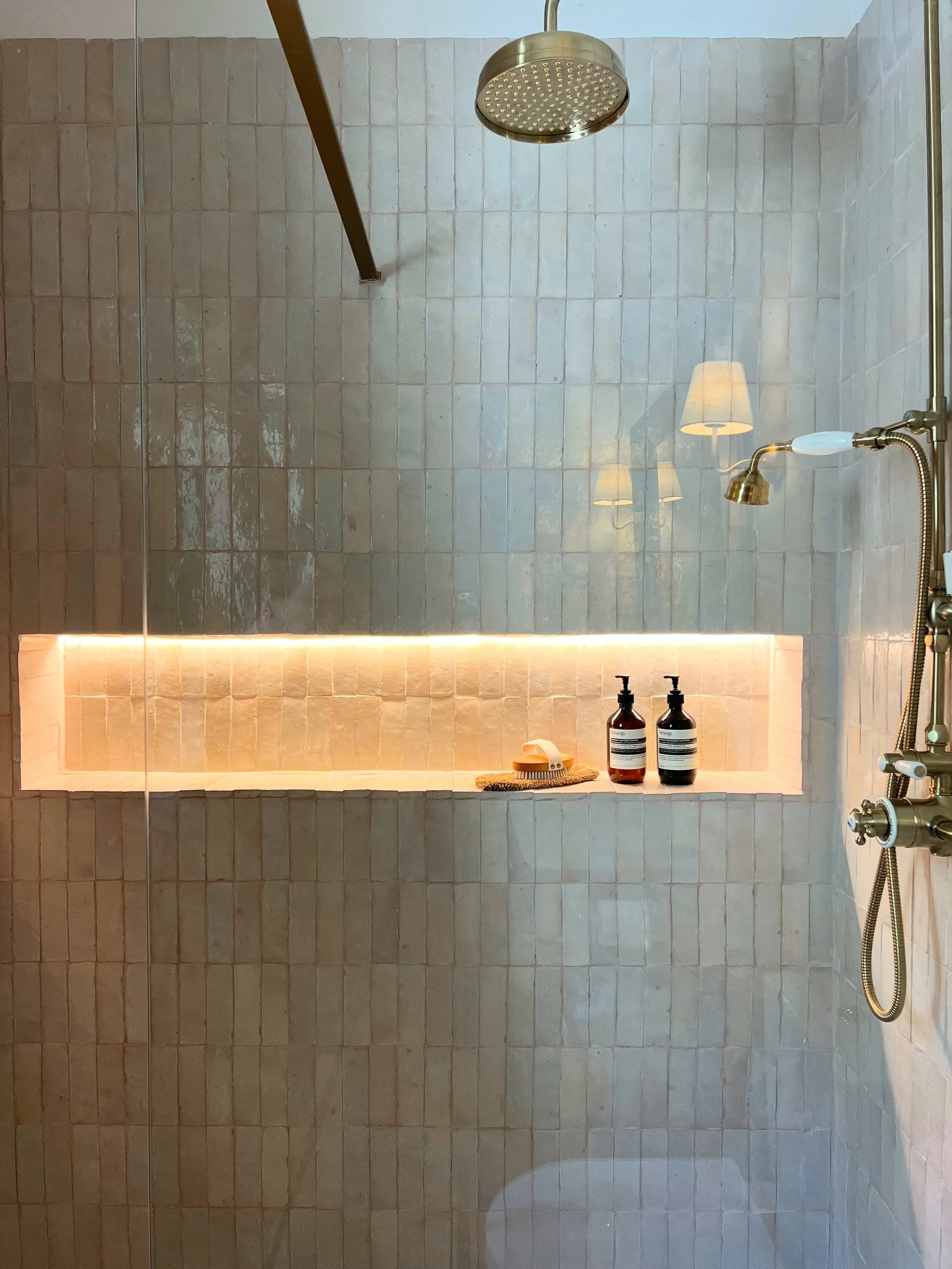shower with lighting in the niche tiled in zellige handmade tiles, brass taps, luxury bathroom, wellness