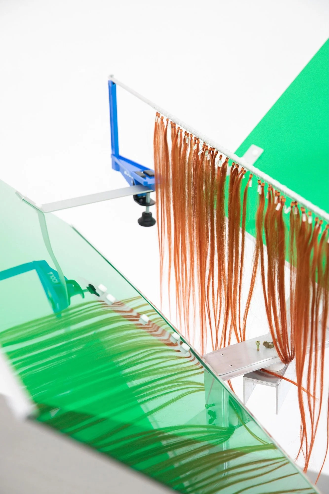Jule Tabea Martin, Joola, 2022, human hair extensions, motor, plexiglass, metal
