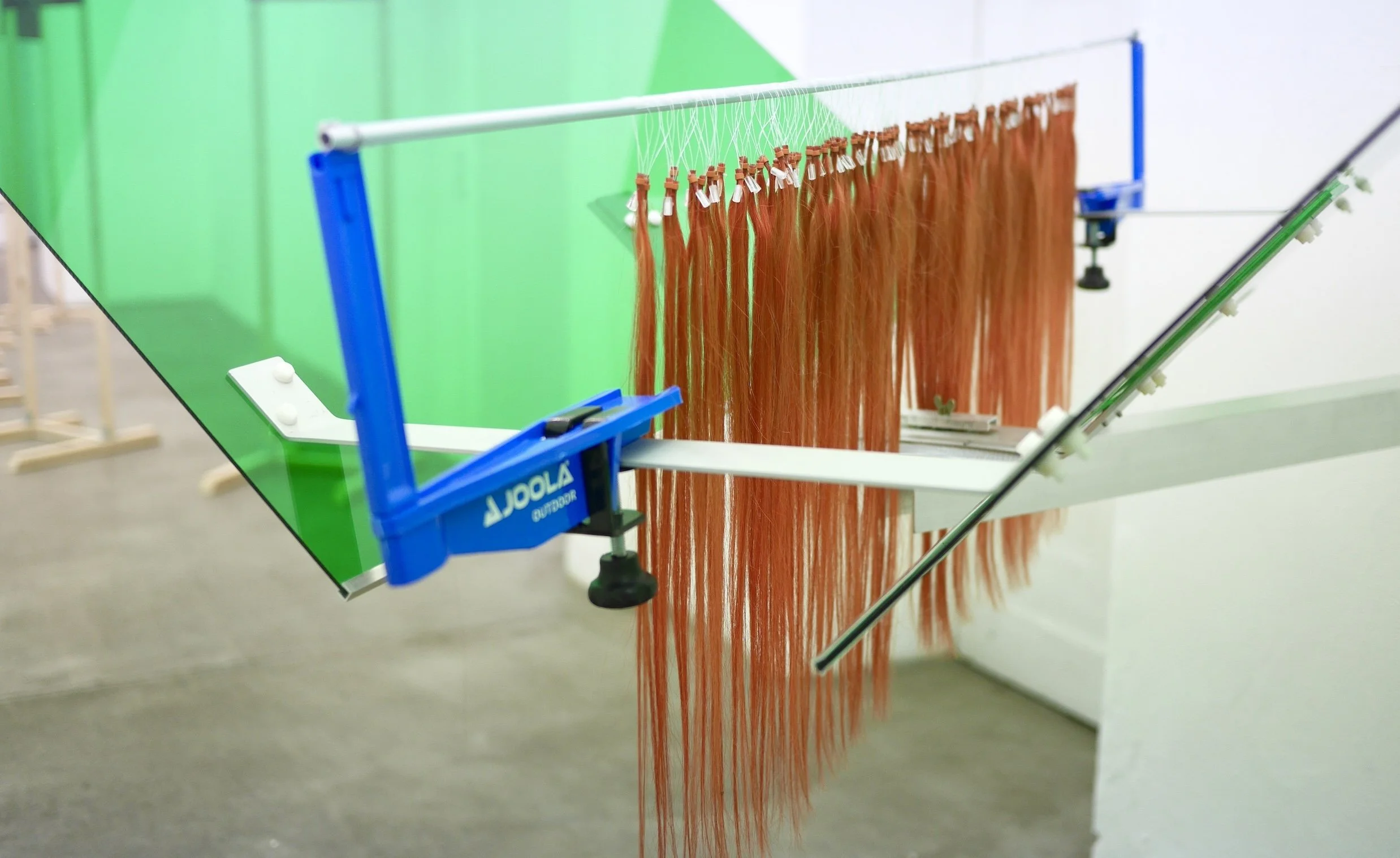 Jule Tabea Martin, Joola, 2022, human hair extensions, motor, plexiglass, metal