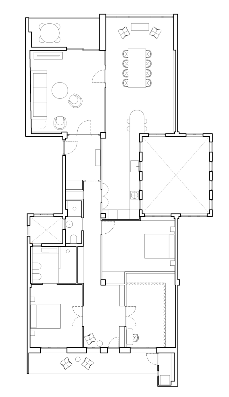 Floor plan of a house with multiple rooms, including bedrooms, a living room, dining areas, bathrooms, and a kitchen.