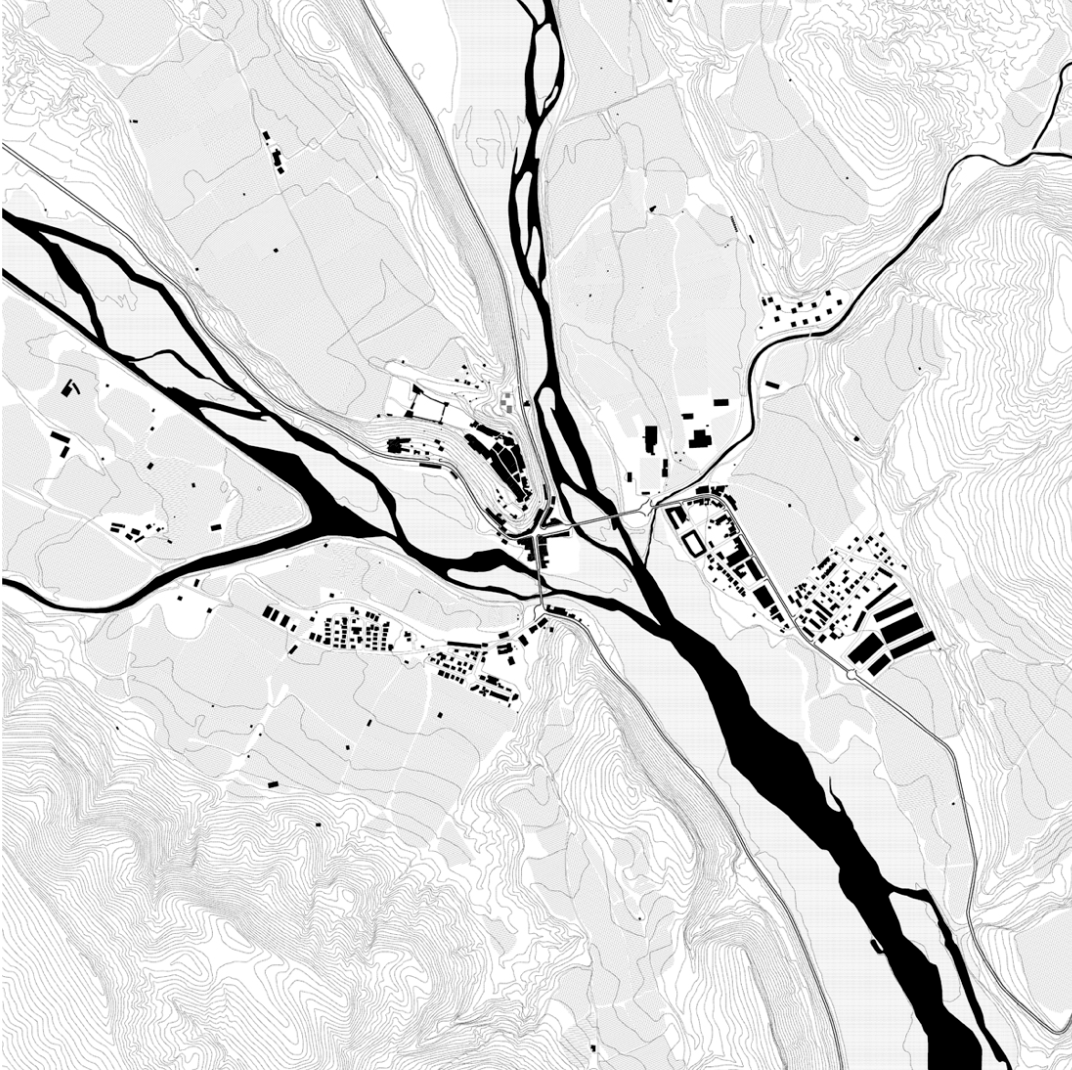 A black and white map showing a town or city with streets, buildings, and waterways. The map features contour lines indicating elevation changes, with a large river running through the center.