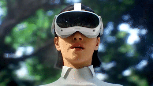 Person wearing a virtual reality headset outdoors with a blurred green forest background.