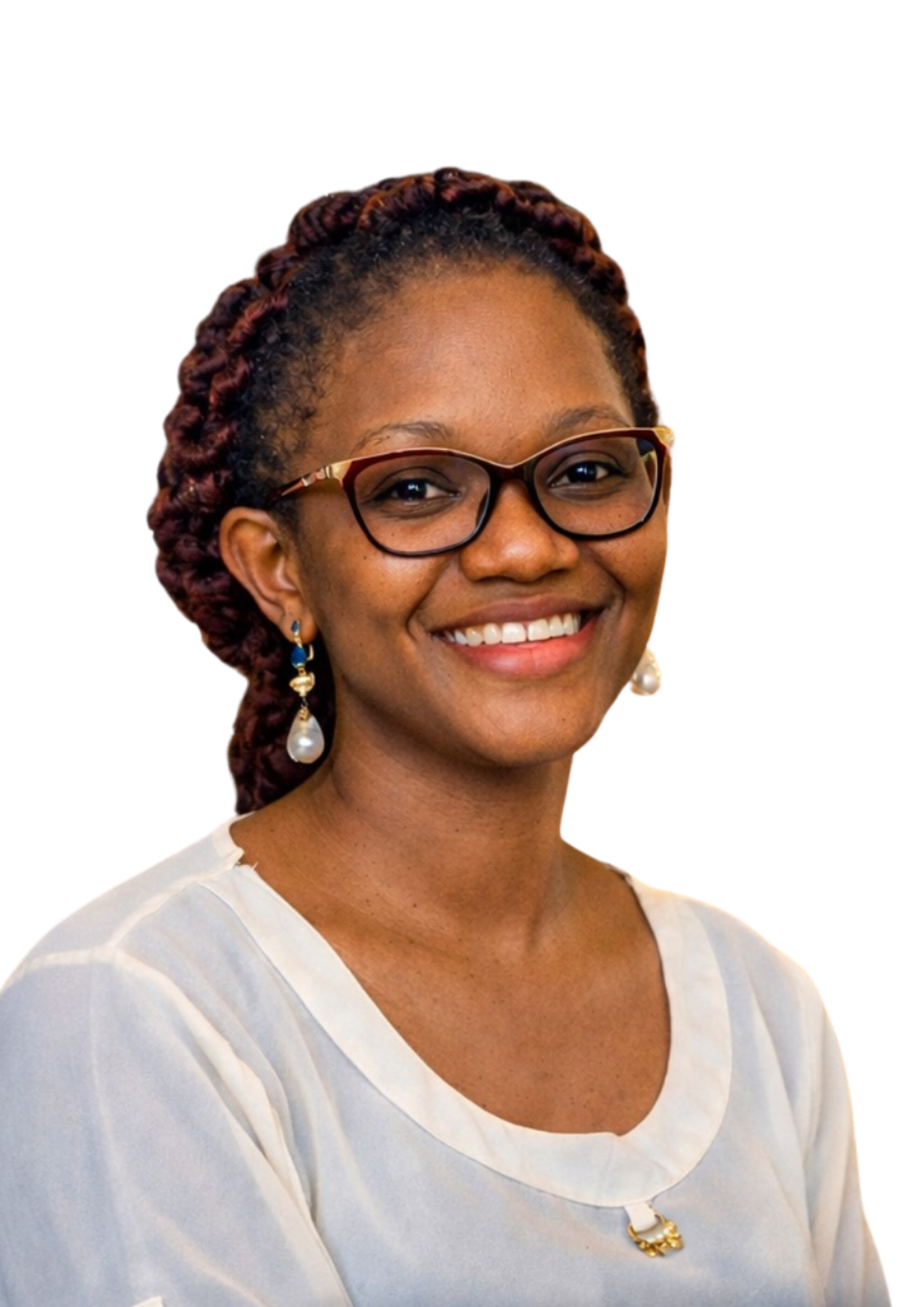A woman with glasses, earrings, and a necklace smiling, dressed in a light-colored top, against a white background.