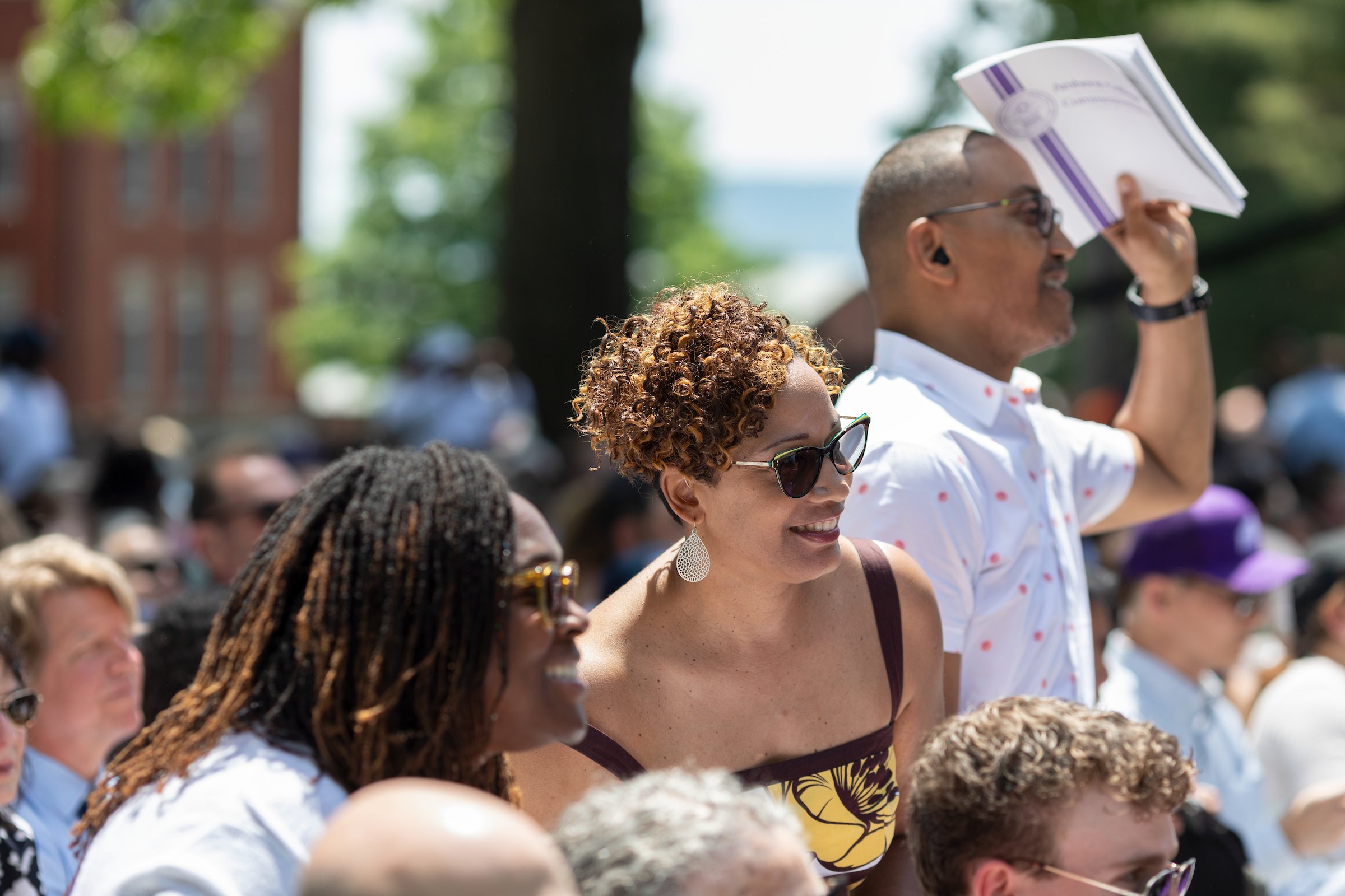 A photo of visitors cheering on their graduates at Amherst College's 2024 Commencement.