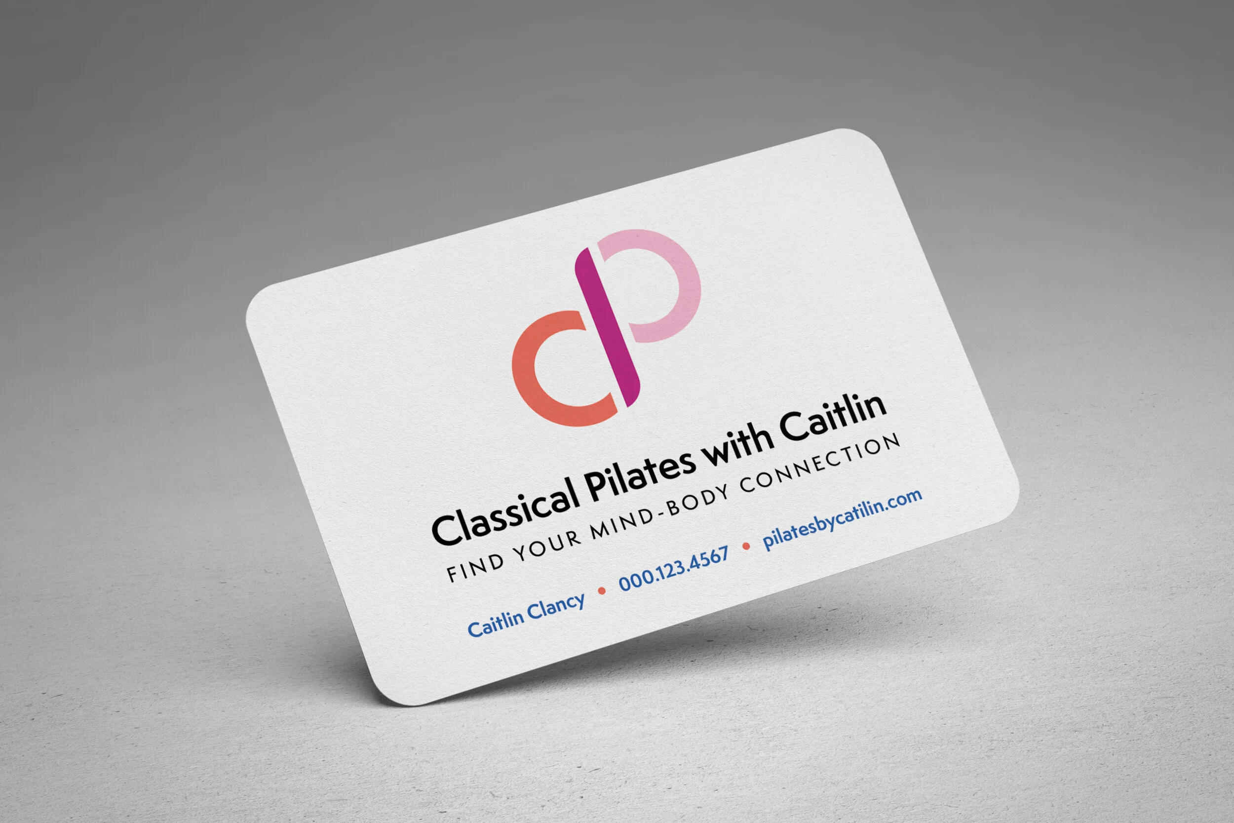 A business card mockup featuring the "Classical Pilates with Caitlin" logo and contact information.