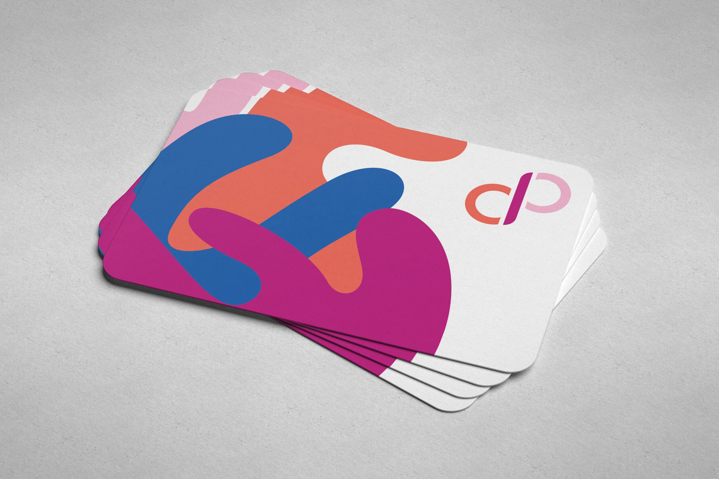 A mockup of the back side of a business card featuring the "Classical Pilates with Caitlin" logo and contact information.