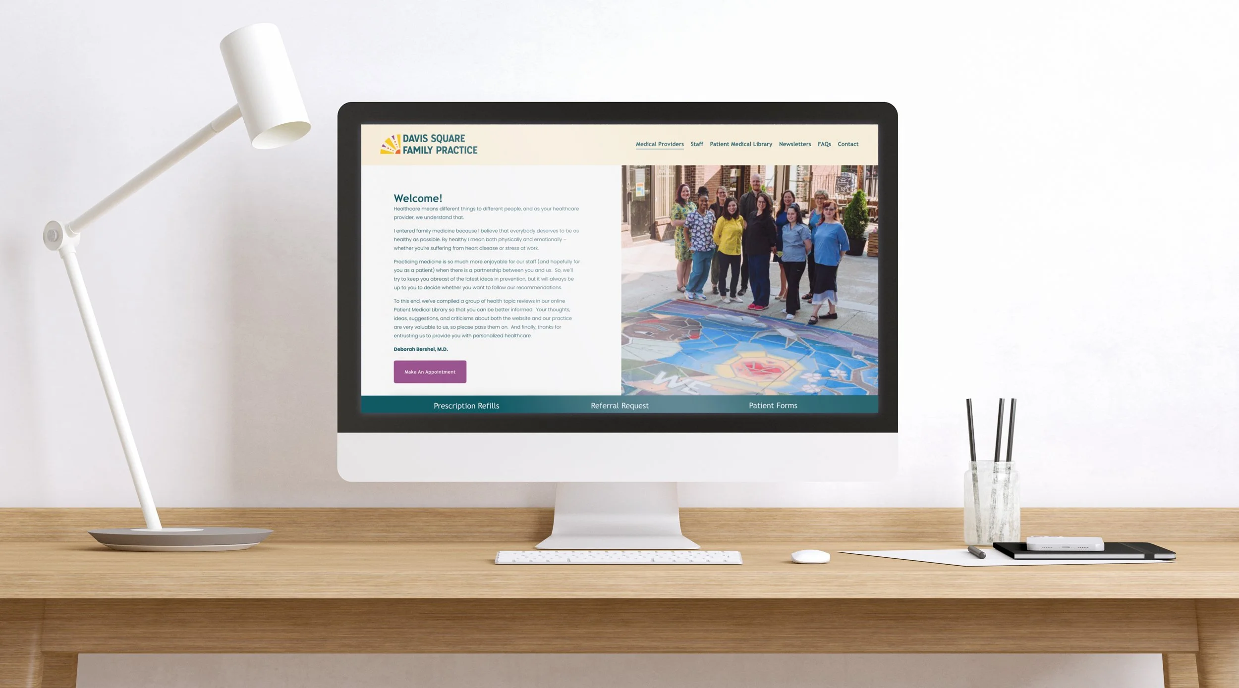 A mockup of the Davis Square Family Practice website shown on a computer monitor.