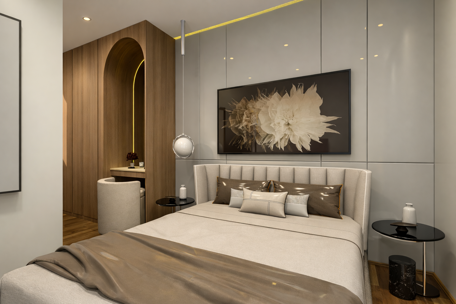Modern bedroom with beige upholstered bed, decorative pillows, wall-mounted floral art, bedside tables with vases, a hanging pendant light, and a small workspace area with a chair and table.