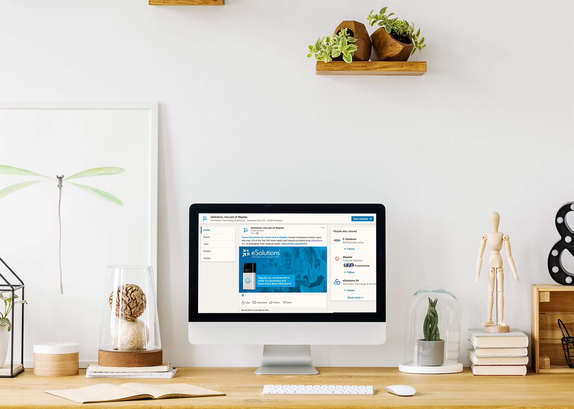 mockup-of-an-imac-placed-on-a-desk-by-wooden-shelves-36561-r-el2.png