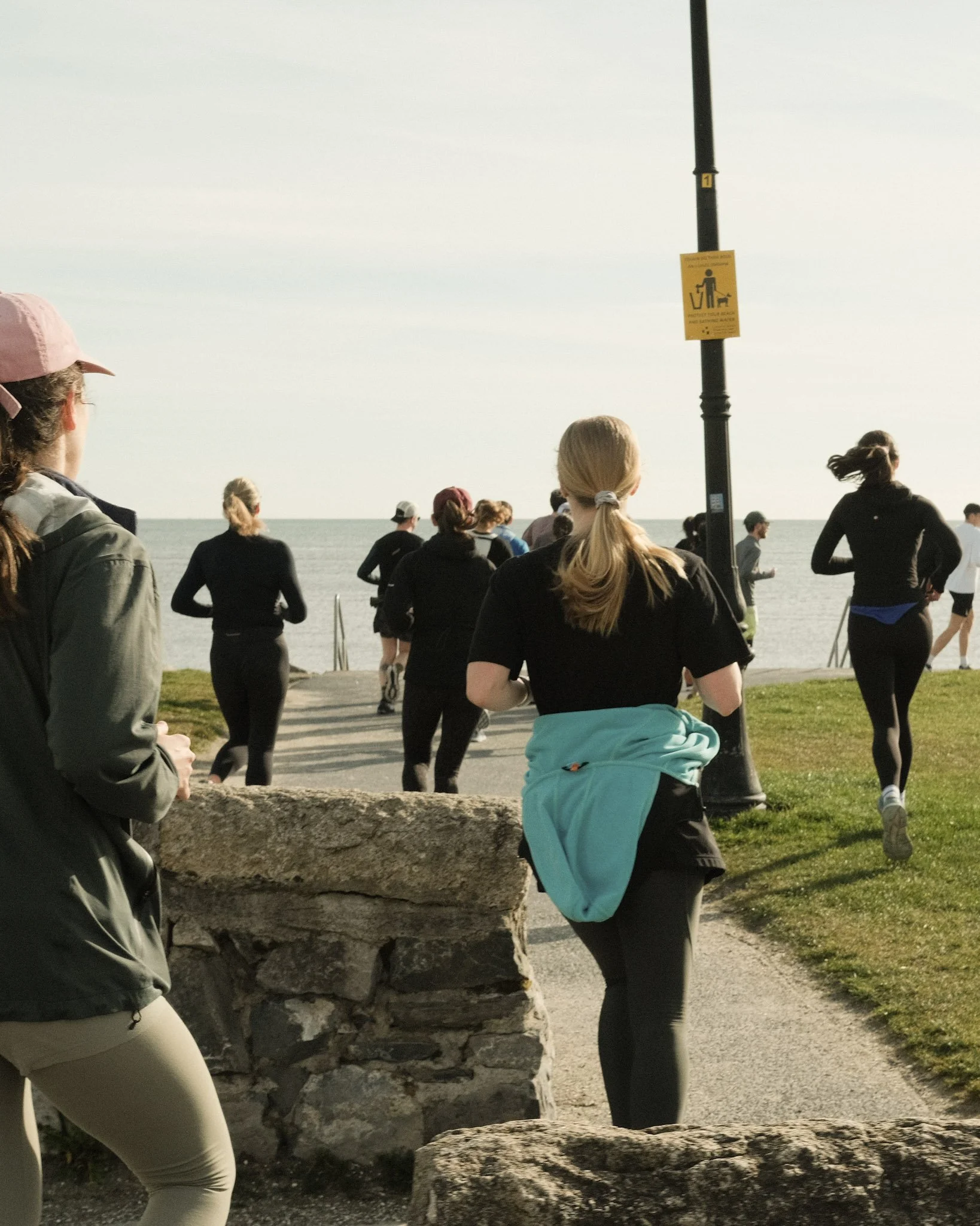 Members running near Sandymount Beach