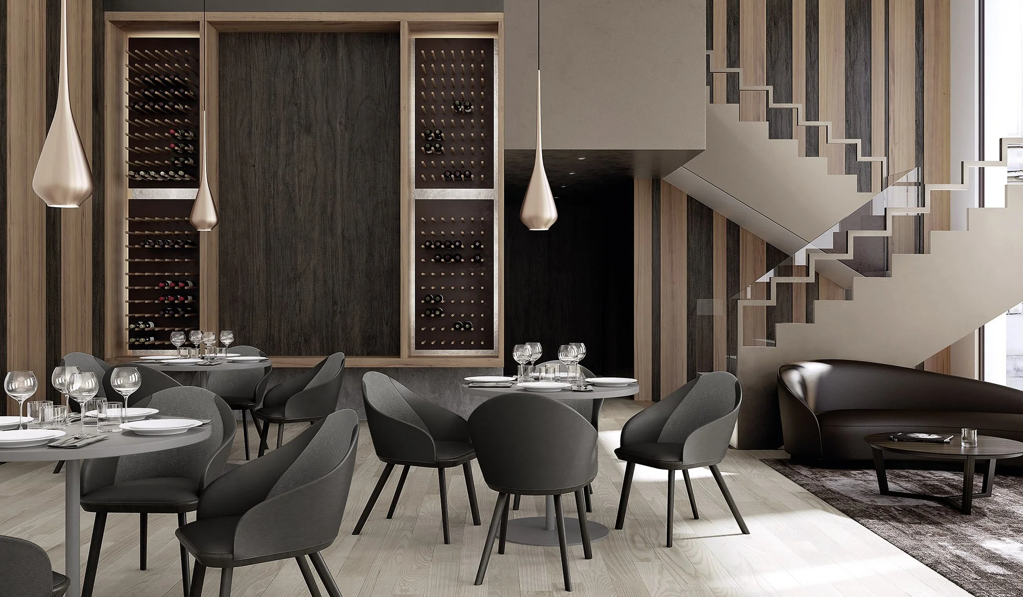 Modern restaurant interior with dark gray chairs, round tables set with wine glasses and plates, wood-paneled walls, wine racks, hanging pendant lights, a staircase, and a sitting area with a curved sofa and coffee table.